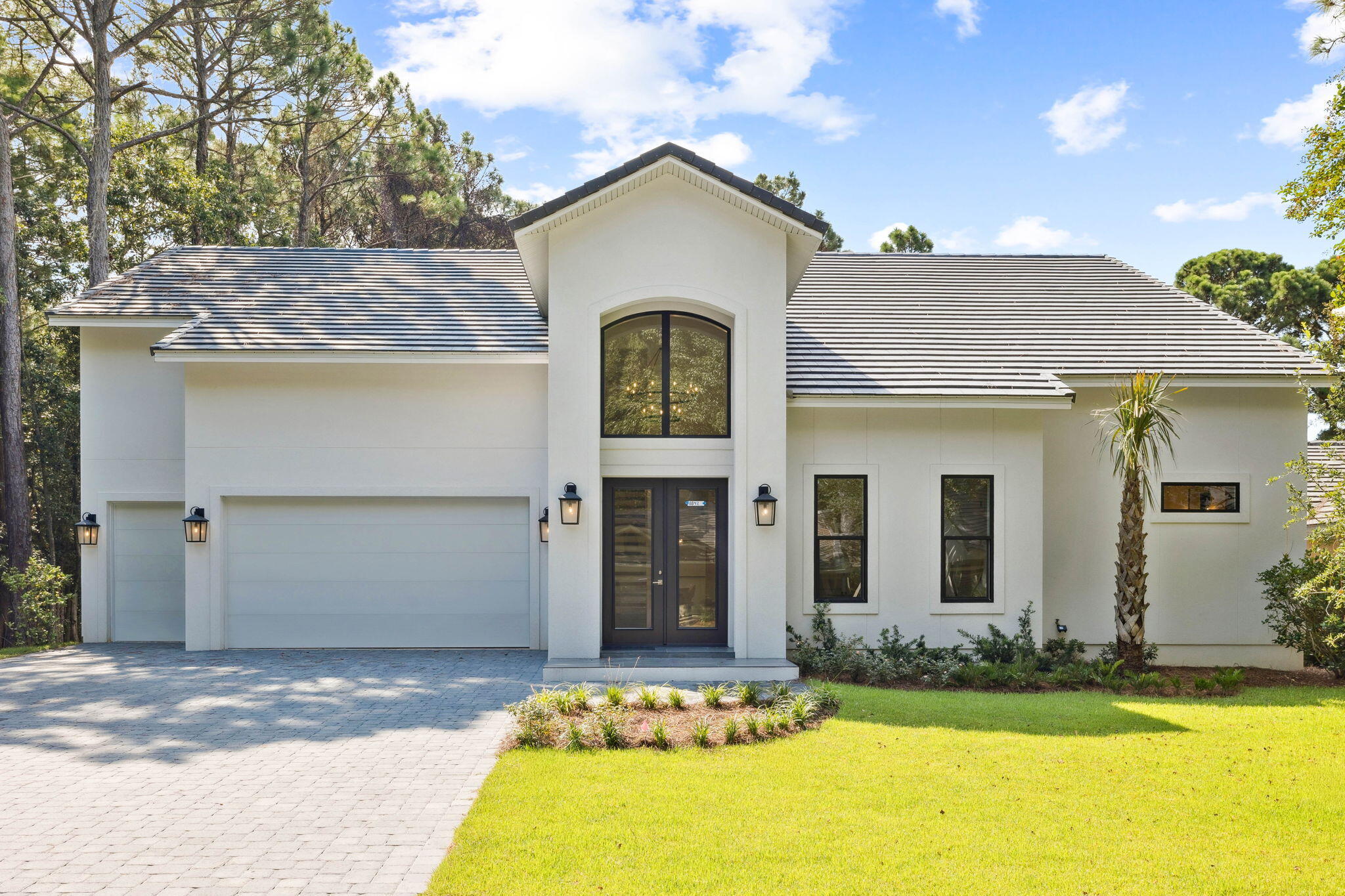Be the very first to experience the elegance of 8842 St. Andrews, a brand-new masterpiece just being completed. Perfectly placed in the exclusive enclave of St. Andrews within Sandestin Golf & Beach Resort, this home offers rare tranquility with the nature preserve as your backdrop and neighbor. Here, privacy meets prestige—quiet, tree-lined streets wind toward your doorstep, while world-class resort amenities, championship golf, and sugar-white beaches remain just minutes away.

A stately front entry opens to a light-filled foyer, where custom fine finishes hint at the craftsmanship found throughout. Down the hall, the impressive great room takes center stage, featuring stunning ceiling beams, a cozy fireplace, and an abundance of windows that cast natural light throughout the expansive space. The chef's kitchen is a showpiece in both form and function, anchored by a sprawling center island and equipped with high-end appliances, dual sinks, and a pantry. Entertaining is effortless, whether you're hosting a lively gathering or preparing an intimate, restaurant-worthy meal.

The home's seamless connection to the outdoors is a hallmark feature. A patio with summer kitchen and grill invites you to savor Florida's year-round sunshine, while the landscaped backyard offers tranquil vistas of the preserve stretching beside and behind the home.

The primary suite is a private retreat, featuring a generously sized bedroom and a custom-fitted luxury dressing closet with sitting area. The spa-like bath includes an expansive shower with the soaking tub, shower bench, and elegant tile work all enclosed. A private patio off the primary suite is perfect for quiet mornings or starlit evenings.

On the main level, a versatile fourth bedroom with walk-in closet serves equally well as a guest room, office, or flex space, with direct access to a stylish bath that also functions as a powder room for the main living spaces. Upstairs, two spacious guest suites each enjoy their own bath and walk-in closetone with built-in bunks for added versatility. The second guest suite also features an oversized storage room, easily reimagined as a theater, craft room, or fitness studio.

With a two-car garage plus golf cart bay, a prime position in one of Sandestin's most peaceful neighborhoods, and effortless access to the resort's world-class amenities, 8842 St. Andrew's offers an unparalleled lifestyle. Residents enjoy abundant amenities, including 5-Star golf courses, tennis and pickleball, biking and hiking trails, a 210-slip full-service marina, and the vibrant Baytowne Wharf for dining, activities, and shopping. The ever-growing Grand Boulevard Town Center, featuring Emeril's and other great restaurants, retail shopping, Starbucks, a movie theater, and Publix Grocery, is a short golf-cart ride away.

A home of this caliber, in this location, is a rare opportunity crafted for those who appreciate quality, privacy, and the beauty of the Emerald Coast.