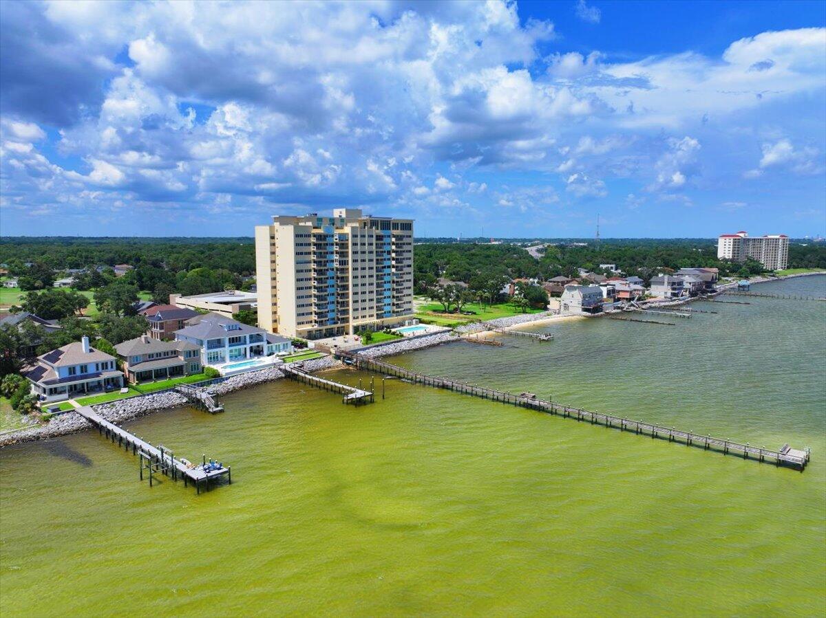 Furnished  2Br/2BA WATERFRONT unit at Bayshore Condominiums! Corner Bayside unit, gorgeous views, fantastic windows! Only corner units have totally open balconies, new insulated balcony door 2021, totally remodeled 2021, 01 units are on best side -- views of Pensacola Naval Air Station and 3 mile bridge, complex has largest pier on Pensacola Bay, watch Blue Angels practice right from your balcony. Pensacola Country Club just up the road. Kitchen updates include refaced cabinets, new countertops, appliances, flooring, lighting -- Bathroom has new walk in shower with new vanities, toilets, flooring. NO SHORT TERM RENTALS! No pets other than ESA and service animal