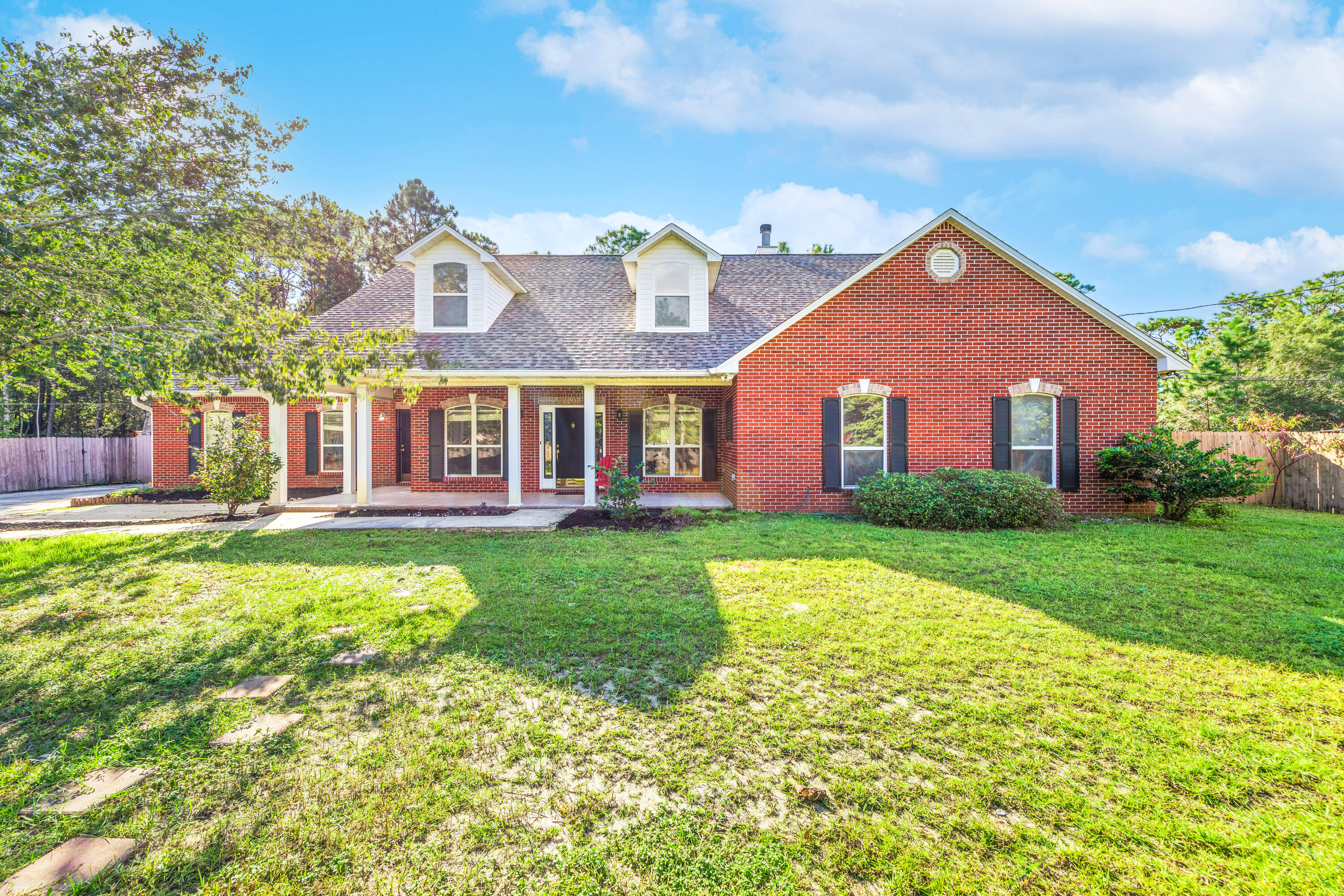 ***An Absolute Showstopper***This is the one you have been waiting for!! OVERSIZED corner lot that has been NEWLY FENCED in Holley By the Sea. This 4 bedroom 3 bath house has ALL the upgrades!! To begin, there is a STUNNING kitchen with GRANITE, white cabinets and STAINLESS appliances. The main floor is wood plank tile and HARDWOODS in the bedrooms. The master bath boasts a HEATED FLOOR and custom TILE shower and Jacuzzi tub. This OPEN CONCEPT house centers around a wood burning FIREPLACE. There is a  2nd story bedroom with 3/4 bath, wet bar and separate entrance! It is perfect for an in-law, young adult or a tenant. This house has a GAS TANKLESS water heater, an 18 SEER AC, & brand new leech field. There is a side yard with a DOUBLE GATE, play-set, zip-line, TOO MUCH TO LIST! MUST SEE!