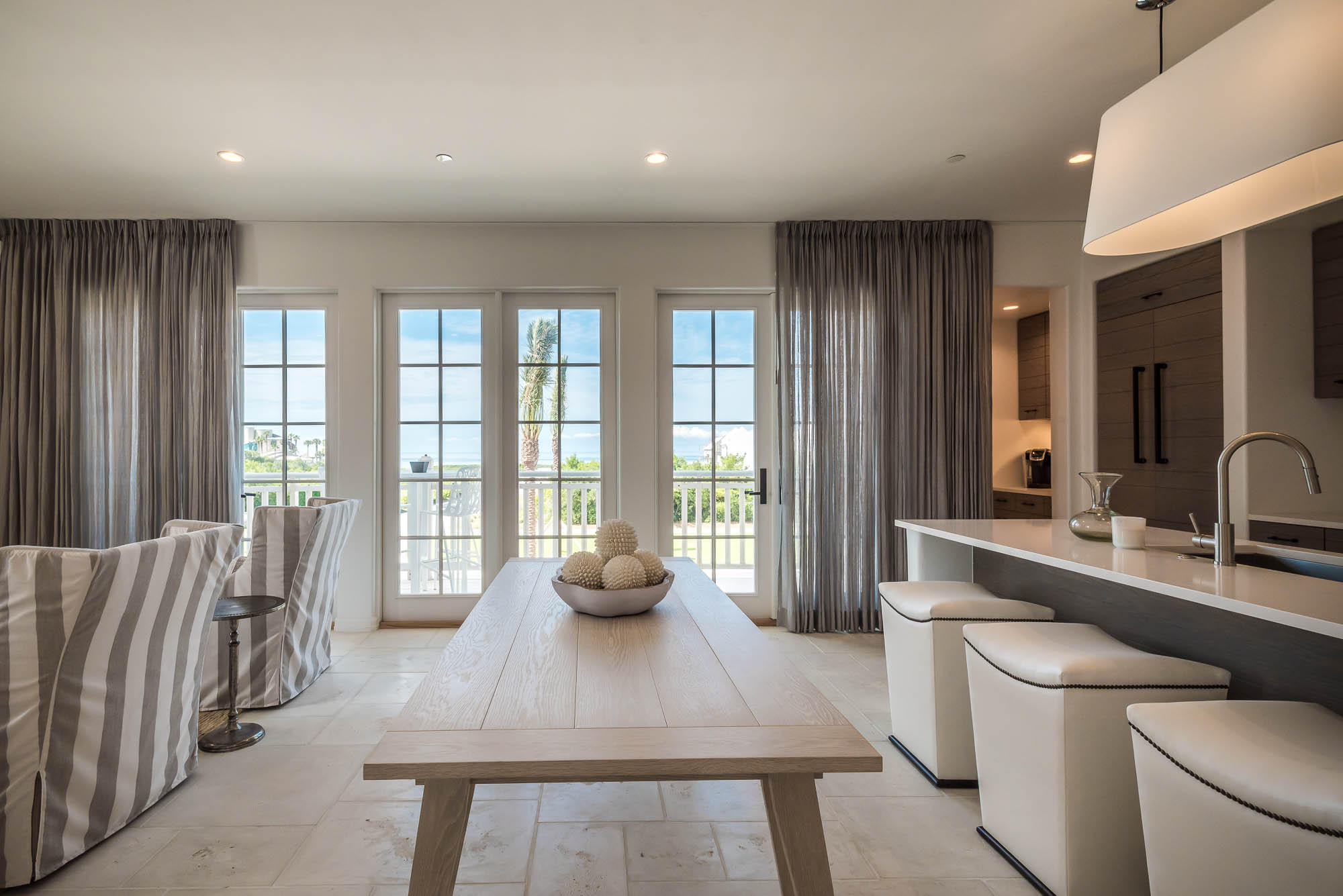 Indulge in Gulf views from the balcony of this second floor Lucian residence. Located on the southeast corner, second floor of the first building in the growing Alys Beach Town Center, the 2 bedroom & a bunk, 2.5 bath open-floor plan condominium has exquisite interiors that reflect a coastal contemporary lifestyle. Thoughtfully selected furnishings and artwork by Tracery Interiors, enhance each room in this light-filled home. Luxury fixtures and finishes include Veneer plaster, Siena Silver Travertine, fire rock tile, Thermador and WaterMark. Owners enjoy parking in an underground parking garage.