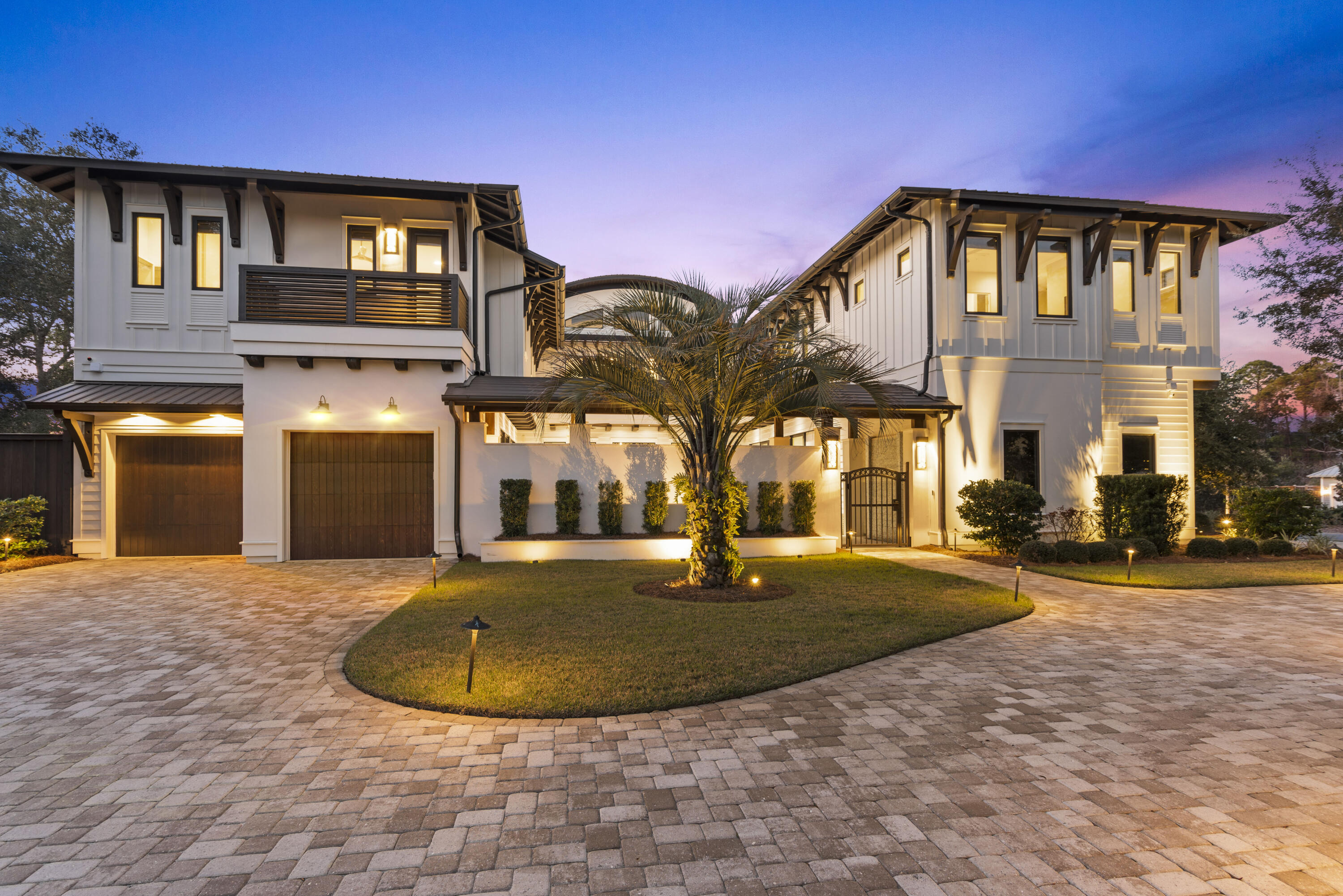 Welcome to your personal sanctuary, a luxurious home nestled on one of the largest lots in Old Seagrove. This sleek oasis offers a multitude of impeccable custom finishes throughout the home including, but not limited to; the over-sized gourmet chef's kitchen with all stainless steel upgraded appliances, a dual Wolf oven, dual sub-zero refrigerators, dual dishwashers, and an expansive butlers pantry. Enclosed behind two french doors is the master suite which opens up to the radiant courtyard overlooking the serene pool, complete with automatic lowering Hunter Douglas Blinds. Heated flooring welcomes you to the master ensuite bathroom that encompasses custom floating his and her vanities. The breathtaking aura of this home continues to the second story via an iron floating staircase. The upstairs north wing includes the idyllic entertainment area, an additional exclusive master bedroom with an en-suite and large walk-in closet. The south wing includes three additional bedrooms each supplying their own en-suite and walk-in closets. The features of this home are as practical as they are gorgeous which includes a 3 car garage, a laundry facility on each floor; first floor laundry room includes a built-in dog washing station. This home's unique presence is increased by the outdoor entertainment courtyard, completed with a summer kitchen, a luxurious heated pool, a gas fire pit surrounded by comfortable lounge seating all encompassed by the soothing fountains. Though this home offers the highest quality of living within its walls, there are exterior benefits to be taken advantage of. There are multiple beach accesses a short walk away. Family and friends will enjoy the ability to walk to Seaside, bike to Watercolor for lunch, or drive a golf cart down to Grayton Beach. This alluring masterpiece of a home provides an unparalleled atmosphere for creating memorable moments and still affords all the practicalities found in your dream home.