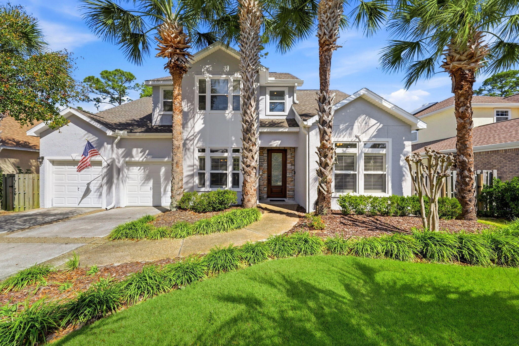 Welcome to 2527 Pelican Bay Drive, a beautifully designed 5-bedroom, 3-bathroom custom home offering 3,164 square feet of thoughtfully designed living space in the highly desirable Pelican Bay community.  

Framed by mature, lush landscaping and meticulously cared for by just two owners, this home makes a striking first impression with soaring living room ceilings and timeless engineered hardwood flooring. The kitchen blends beauty and function, featuring white cabinetry, dark granite countertops, a gas range, a large stainless-steel sink, and custom pantry shelving with pull-out drawers that offer convenient, effortless organization.

The first floor offers both flexibility and comfort. A guest bedroom or private office sits alongside a full bath, plus additional storage tucked beneath the staircase. You will also enjoy a formal dining space and a designated eat-in kitchen area, ideal for hosting or everyday living. The spacious primary suite is conveniently located downstairs, overlooking a serene backyard with no rear neighbors. The ensuite bath offers a double vanity, soaking tub, oversized walk-in closet with a custom storage system, and plenty of room to unwind.

Upstairs, three additional bedrooms and a full bath provide space for family or guests. One of the upstairs bedrooms is exceptionally spacious (20x30), offering incredible versatility. This room can easily serve as a guest suite while also functioning as a home gym, children's playroom, media room, or creative studio. Just off the bedroom is a generous private balcony (28x12) that overlooks the lush, natural landscaping of the backyard, creating a peaceful outdoor retreat.

Recent updates add both value and peace of mind, including fresh exterior paint, two HVAC systems installed in 2022, a 2018 water heater, newly installed impact-resistant windows on the north side, new roof (2018), and a 10KW Generac generator. The home is also wired for indoor and outdoor surround sound, enhancing everyday living and entertaining alike.

Step outside to discover a truly private backyard retreat. Beyond the fence lies a protected DEP conservation area, ensuring permanent privacy with no future development behind you. The expansive screened-in porch and privacy-fenced yard create the perfect setting for relaxing evenings or weekend gatherings. Located in flood zone X, no flood insurance is required for this property.

Pelican Bay is a desirable community located near Bay Point and just minutes from Publix, local dining favorites, and shopping. You are also a short drive to the sugar-white sands of Panama City Beach and the natural beauty of St. Andrews State Park. HOA dues include common area landscaping, access to the community pool, hot tub, pool house amenities, and dock.

This is more than a home; it is space, privacy, and lifestyle all in one.