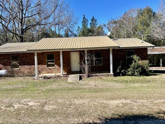 Are you in search of a brick residence in the countryside? Your search ends here. The home is situated on a county-maintained dirt road. It features a newly installed 2.5-ton central heating and air conditioning system, along with 3 bedrooms and 1.5 bathrooms. The master bedroom includes a half bath which has potential space which could be converted to shower. The carport has been enclosed and repurposed as a den with sliding glass door to back yard.  The kitchen boasts ample cabinet space and a dinette area. There is a lovely front porch, allowing you to add your personal touch to make it truly feel like home. It is move-in ready, and there is an extra-large barn measuring 32 x 48, suitable for  workshop, parking, or equipment. Schedule your showing before this opportunity slips away!