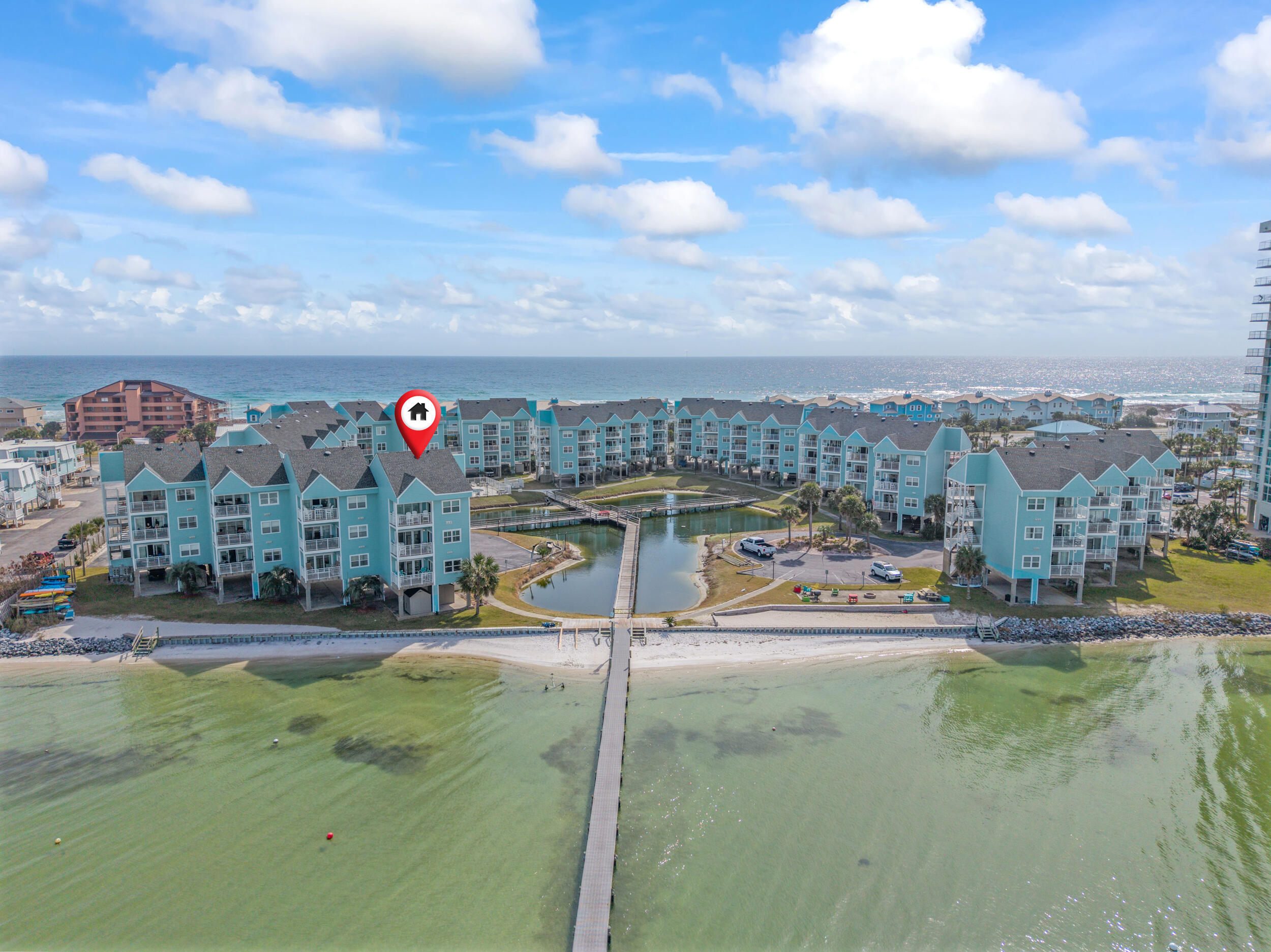 Experience true waterfront living in this second floor, 2-bedroom, 2-bath residence perfectly positioned on the Santa Rosa Sound! This unit is being sold FULLY FURNISHED! Located in one of only two buildings in the complex that sit directly on the water, this unit offers unobstructed views from the private balcony where you can enjoy breathtaking sunrises over the Sound. Whether you're seeking a full-time coastal paradise or a strong investment opportunity, this property delivers. With rental projections coming in at $45K annually, it offers excellent short-term rental potential as well as long term with snowbirds! Lovingly maintained and owned by only two Owners and only minutes from local favorites like Peg Leg Pete's and Ft Pickens Gulf Island National Seashore. Inside, enjoy an open fl oor plan anchored by views of the water. The kitchen features abundant cabinetry, granite countertops, a wine cooler, and a breakfast bar. The primary suite offers a view of the sunrise from your bed, and features direct balcony access, while the en-suite bathroom includes a spacious tub/shower combination. The second bedroom also offers direct access to a full bath with a tub/shower combo, which conveniently connects to the main living area for guest use. Both bedrooms feature appealing and functional plantation shutters. Baywatch amenities enhance the waterfront lifestyle with a community pool, fishing pier, and a shoreline beach complete with a seawall, ideal for kayaking and enjoying the calm waters of the Sound. The complex also features a storage area for kayaks right near the water. The unit includes two assigned covered parking spaces and two exterior storage areas, a private closet outside the front door and a shed near the parking area, providing convenience and extra room for your beach gear. Don't miss this opportunity to own this waterfront gem where unmatched views, exceptional amenities, and coastal beauty come together in the heart of Pensacola Beach!