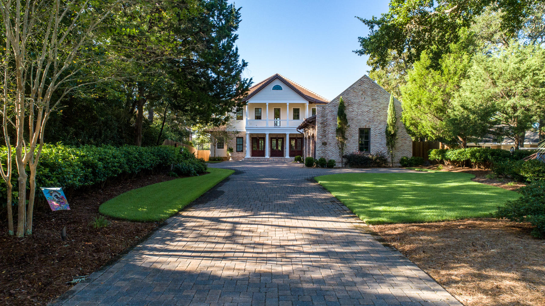 WATERFRONT ARCHITECTURAL MASTERPIECE! From the minute you drive up the pavered driveway you'll notice the quality and details everywhere. Step into the foyer to find columns, Victorian hotel pendent RH lighting and a dramatic open staircase with custom wrought iron. Spacious living area with beamed ceiling, custom built-in cabinets, gas fireplace, wide plank re-claimed heart pine flooring throughout, and windows that span the breathtaking views of infinity pool and water. Entertaining will be a delight in your open concept dining area with two built-in buffets. Gourmet kitchen is top-of-the line with Thermador appliances, sub-zero icemaker and beverage cooler, custom cabinets with glass fronts above, beautiful granite counter space, and large center island with a breakfast bar. Waterfront master bedroom suite with access to the pool and spa, separate bath with double vanities, spa tub, and a large steam shower with seat, separate walk-in closet, and a make-up station or office area.  Ascending up the staircase you will find a free standing walnut piano curved overlook perfectly appointed for the sitting area with ship lap walls and French doors that lead out to the front balcony.  Two additional bedroom suites with baths.  One of the bedrooms is waterfront and has access to the 38ft x 10ft balcony with incredible water views.  Ultimate game room complete with custom built-in heart pine cabinets, surround sound and a wet bar with subzero beverage refrigerator this room could also be used as a fourth bedroom/office with separate access to the balcony.  

Your resort lifestyle awaits you in the backyard with a custom designed heated infinity pool with tanning ledge and spa surrounded with coral stone pavers for cool decking and two firepots for ambience.  Imagine entertaining family and friends year round in your outdoor brick cabana with fireplace, media and surround sound.  Outdoor kitchen with Naturekast cabinetry, Lynx and Fire Magic appliances to include gas grill, sink with hot and cold water, warming drawer, separate gas burner and beverage center, Brazilian hardwood deck and plenty of counter space for parties of any size you host.   

Get ready for fun on the water with your own dock complete with a covered boat house with a 20,000 lb lift, a 10,000lb boat lift, and two jet ski lifts to go out and cruise the bayous, bay or head out to Crab Island for fun in the sun.

With so many custom features to list we included a feature sheet and a 3D tour. So schedule your own private viewing today!
