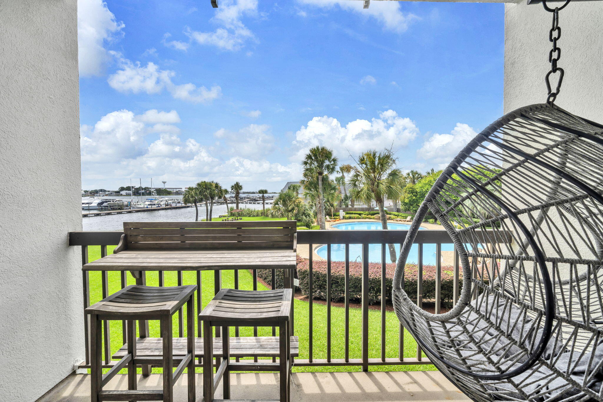 NEW PRICE: Santa Rosa Sound Access +  Slip is 39'length/max allowed 36' Boat - Ready for Rental Income! This beautifully styled, fully furnished studio features warm coastal décor, modern finishes, and wood-look laminate flooring for an upscale beach vibe. The remodeled kitchenette includes an induction stovetop and Apt-size fridge--perfect for guests or weekend getaways. Step onto the balcony and unwind at the bar-height dining set while enjoying tranquil pool views--ideal morning to evening. Access Santa Rosa Sound via the private beach area for kayaking or paddleboarding. The 36' boat slip can be rented short or long term. Deep soaking tub with cultured marble surround. New A/C (2024). Laundry on each floor. Owners may have pets. Minutes to Destin, dining, and beaches!