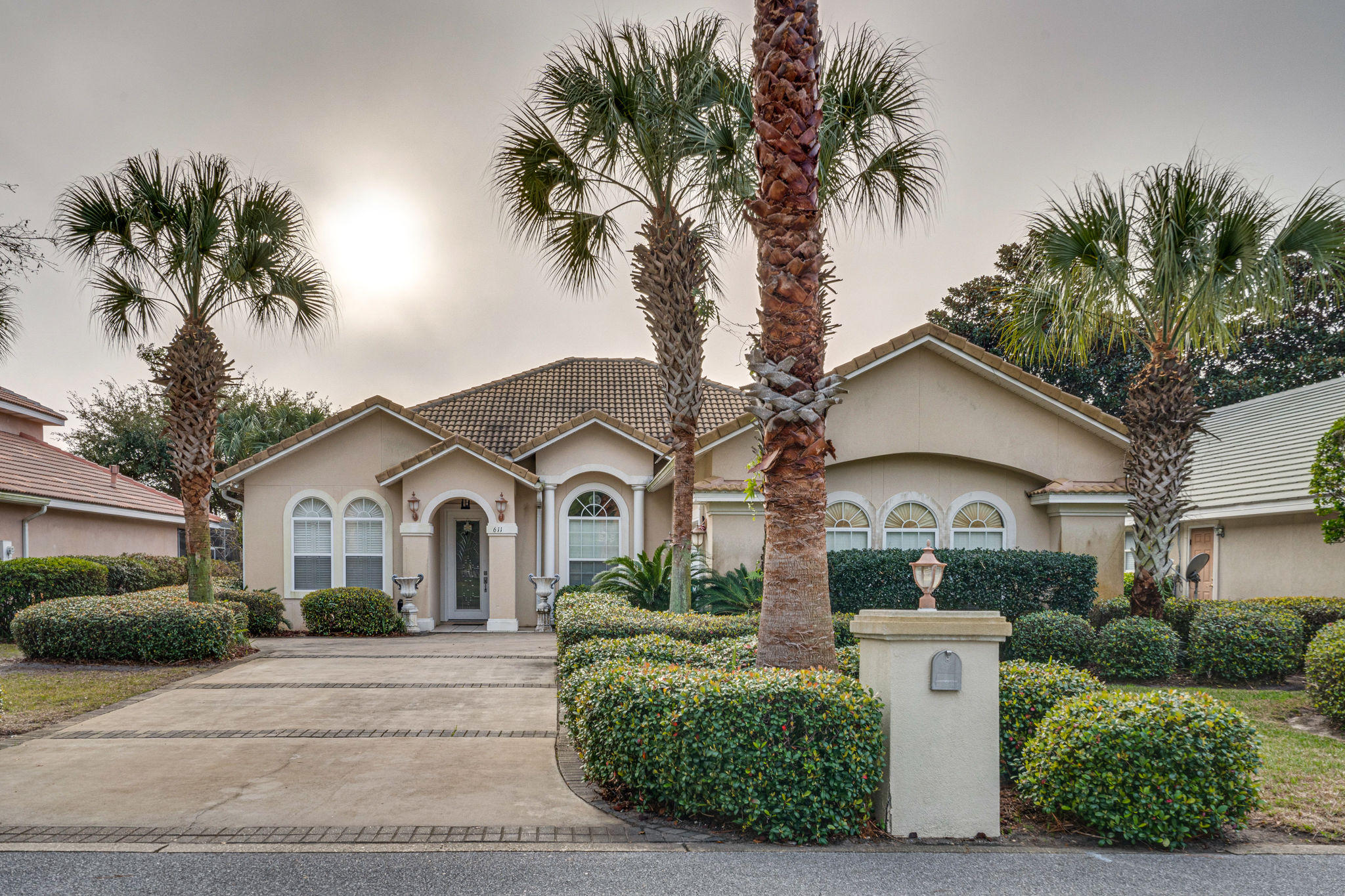 Enjoy great views of the 18th fairway in the gated community of Emerald Bay! This custom-built home boasts a leaded, glass front door that flows to an open-floor-plan with 14 ft ceilings, beautiful archways, crown moulding, recessed lighting, beveled/bull-nose corners, plantation shutters, beautiful faucets, light fixtures and tile flooring throughout.
Enjoy the open-formal dining room adjacent to a large family-living room featuring a marble, gas fireplace. The breakfast nook leads into spacious kitchen featuring all stainless-steel appliances, gorgeous granite counters, pendant lights and large walk-in pantry.
Master suite has trayed ceiling, spacious sitting area, 3 large closets and en suite bath w/cultured marble, double vanity, garden tub/jacuzzi w/block window, and separate show Master and 3rd guest bedrooms open to patio w/private, in-ground, heated pool & hot tub w/screened lanai featuring a black-out bottom for privacy purposes. This home also has owner's suite, large closet and utility sink in laundry room, Mitsubishi A/C in 2-car garage sized at 21 ft x 21 ft w/lots of storage shelves. Low HOA fees.