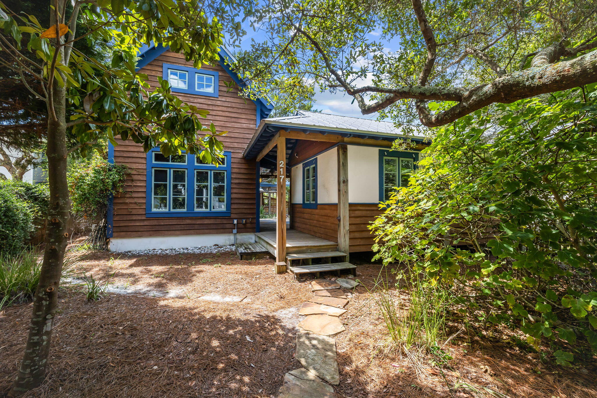 An excellent opportunity to be close to 30A's most exclusive communities and shopping, while maintaining privacy on a wooded 57x153 foot lot, 217 Walton Rose Way is a home base for the young-at-heart and coastal creatives. The site features multiple living spaces which surround a central courtyard, anchored by unique and inspiring landscaping. It is a mere 700 feet from the Gulf of Mexico, where you will find over a half mile of the nearly uninterrupted public beaches of Inlet Beach.