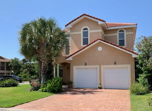Mediterranean style home on a corner, fenced lot. Open floor plan with lots of natural light, custom kitchen with stainless appliances and lots of granite counter space. French doors open from the dining area out to a covered patio. Powder room and laundry on the first floor. Going up the stairway with custom railing to the second floor you will find a spacious master bedroom with French doors that open out to a tiled balcony with custom railing, perfect for morning coffee or evening drinks. Master bath features double vanity, jetted garden tub, separate shower, commode room, and a generous walk-in master closet. Two guest bedrooms, a spacious bath, and another balcony, complete the second floor. This quality built home features 10' ceilings on both floors, 8' doors throughout, crown molding, hurricane rated windows and many more luxury features. This lovely property is in one of Destin's hidden Gems, Calusa Bay! Tucked away between Regatta Bay and Emerald Lakes, this quaint, gated community with stucco homes, tiled roofs, and palms trees is a family friendly neighborhood, complete with sparkling community pool and cabana. You can also take advantage of the pedestrian/bike path thru Regatta Bay as you walk or bike to Destin Commons! This incredible community is close to everything Destin has to offer - beaches, restaurants, shopping, etc. Call today to see this wonderful home!