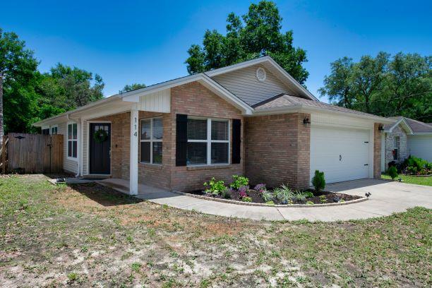 This home features an open floor plan with large living area, dining area, and eat in kitchen. The modern kitchen has been recently updated with refaced cabinets, soft close drawers and doors as well as beautiful granite. The master bedroom is large enough for a king sized bed and still leaves ample space for end tables and dressers. The master walk-in closet and master en suite bath finish the space perfectly. Both baths have been updated with the same granite counter tops as the kitchen. Enjoy morning coffee and sunrises on the screened in patio overlooking the spacious backyard. Pride in ownership shows with new HVAC, fresh paint, Nest thermostat and doorbell. Wired surround sound in the living area (4 wall speakers, sub woofer, and receiver) and double curtain rods convey. See docs.