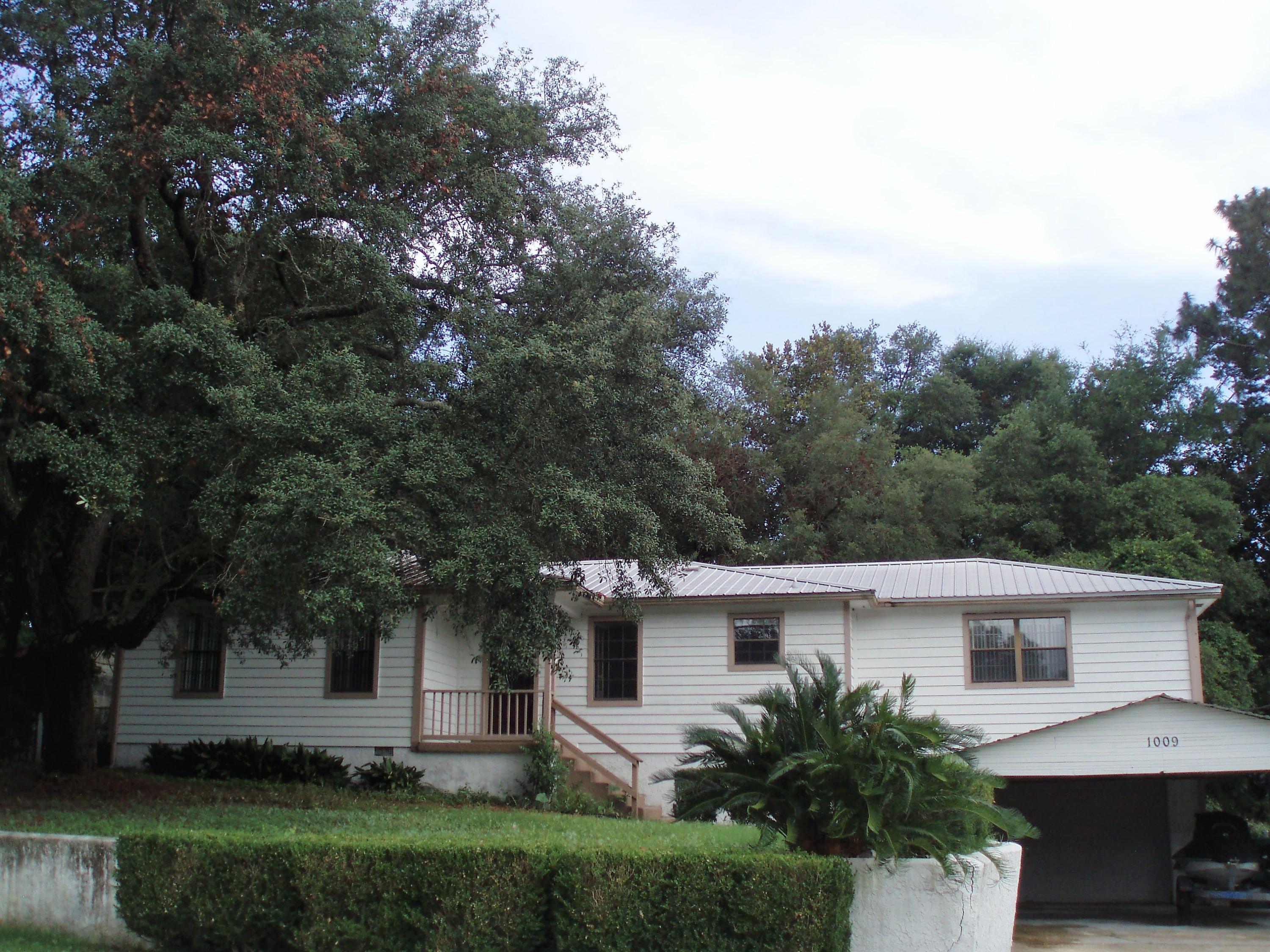 Available November 1st. Eat in Kitchen is sunny and bright. French doors open up to formal Dining Room, or use it as another living room or Media Room. Large Living room has laminate flooring for easy cleaning. Washer/Dryer hook ups. 2 car garage and covered carport, leaves room for plenty of parking. Fenced in back yard. Covered deck in the back. Just minutes to Eglin AFB and public schools and parks. This gem is MOVE IN Ready, so hurry and Call Today! It will not last! Mature pets may be allowed with Non-refundable pet deposit.