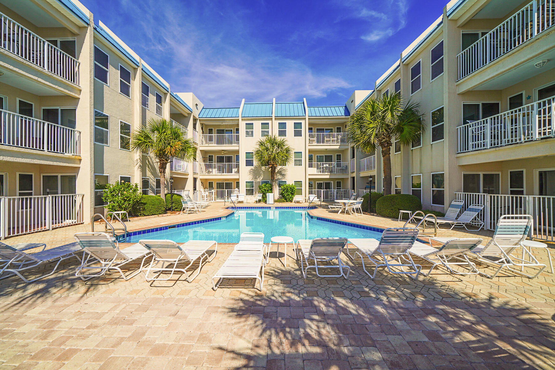 Vacation Getaway on Holiday Isle! Condo perfect for a 2nd home, investment property or primary residence. Short term rentals allowed.  Located 3 doors away from Osteen Public Beach Access. Enjoy Gulf Breezes from the Sparkling Blue Swimming Pool.  Unit features updated decor, vinyl planking flooring, and open floor plan with Kitchen, Dining and Living areas.  New stove recently installed and smooth top counters with white cabinets in kitchen give unit a fresh look.  Contemporary colors and fully furnished.   Enjoy morning coffee on patio accessed by sliders from living room or Master Bedroom.   Master bedroom has en suite bath and there also a full bath in hallway. Stackable washer and dryer for convenience.  Do not miss the opportunity to see this unit today!