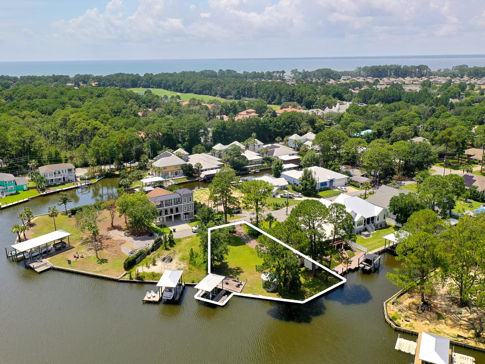 Positioned along Buck Bayou in the heart of Santa Rosa Beach, 83 Anchor Lane presents a rare opportunity to create a bespoke waterfront estate within a discreet enclave north of 30A.

Set on nearly half an acre, this premier homesite offers generous dimensions and exceptional frontage with direct deep-water access - ideal for boating enthusiasts seeking the option to add a private dock and lift. Surrounded by distinguished estate properties, it maximizes navigability to Choctawhatchee Bay while capturing the natural beauty of the bayou.

Hidden Harbor is an intimate, unrecorded subdivision that offers privacy and tranquility while remaining moments from Sandestin Golf and Beach Resort, Grand Boulevard, and the region's premier dining, shopping, and white sand beaches. Framed by mature native foliage, the setting is both secluded and scenic, providing the perfect canvas for a legacy waterfront build. Public utilities are available, and there are no build-out time requirements, ensuring design flexibility without compromise.

For those seeking scale, access, and an exceptional location to create a refined coastal retreat, 83 Anchor Lane embodies the ultimate in bayfront living along Northwest Florida's Emerald Coast.