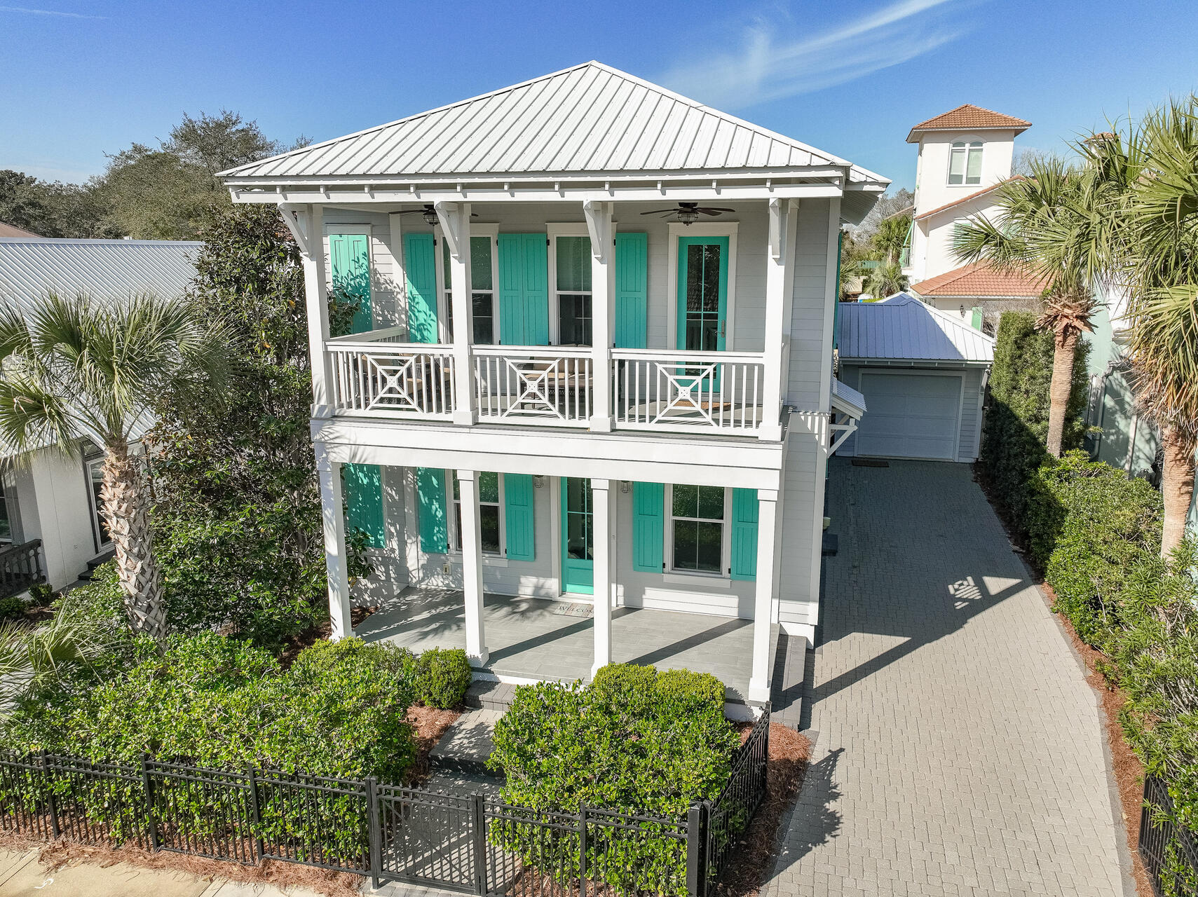 A RARE FIND, PRIVATE GULF FRONT BEACH COMMUNITY WITH A NEWER NEVER RENTED HOME!
Welcome home to Caribe, one of South Walton's most prestigious gulf-front communities offering 500 ft of spacious, pristine, sugar white sandy beach. This quiet guarded gated community welcomes you with tree lined streets, lush 
landscaping, and impressive architecture. Just steps away from the two community beach walkovers with golf cart parking. Caribe offers optional beach setup services. The two story expansive front porches invite you into this newer construction home with airy 1st and 2nd floor 10' ceilings with an open floorplan. Impressive, upgraded finishes include job finished hardwood floors throughout, marble counter and vanity tops, marble-look ceramic tiled bathrooms, showers, abundant can lighting and shiplap wall accents. The impressive kitchen is the heart of the home with a Wolf gas range, Zephyr hood, stainless appliances, large center island, ample white custom lighted stacked cabinetry, surrounded by generous areas for entertaining and dining. The expansive rear covered first floor patio is perfect for alfresco dining and relaxing while overlooking the fenced yard area. The inviting second floor primary bedroom suite features dual oversized walk-in closets, separate vanities, garden soaking tub, and spacious shower with two shower heads. Two additional large second-floor bedrooms each have walk-in closets and on-suite expansive luxury baths. The first floor fourth bedroom, or study, features a walk-in closet, French doors and private access to the first-floor luxury bath. The laundry room has a separate exterior access door, custom cabinetry, utility sink, storage closet and walk-in pantry. An oversized one car garage is connected to the home by a covered breezeway. Impact rated doors and windows, energy conscious upgraded wall and attic insulation, dual zoned HVAC, fiber cement siding and metal roofing ensure lasting value. In addition to direct beach access, Caribe features two community pools (one heated), tennis/pickleball courts, and beach bathrooms. Short-term rentals are allowed. The community is conveniently located close to abundant shopping, restaurants and medical facilities. This RARE FIND is perfect as a primary residence, second home or vacation rental.  Experience luxury living and beach access at its finest in the beautiful community of Caribe today! Buyer to verify all information and dimensions.