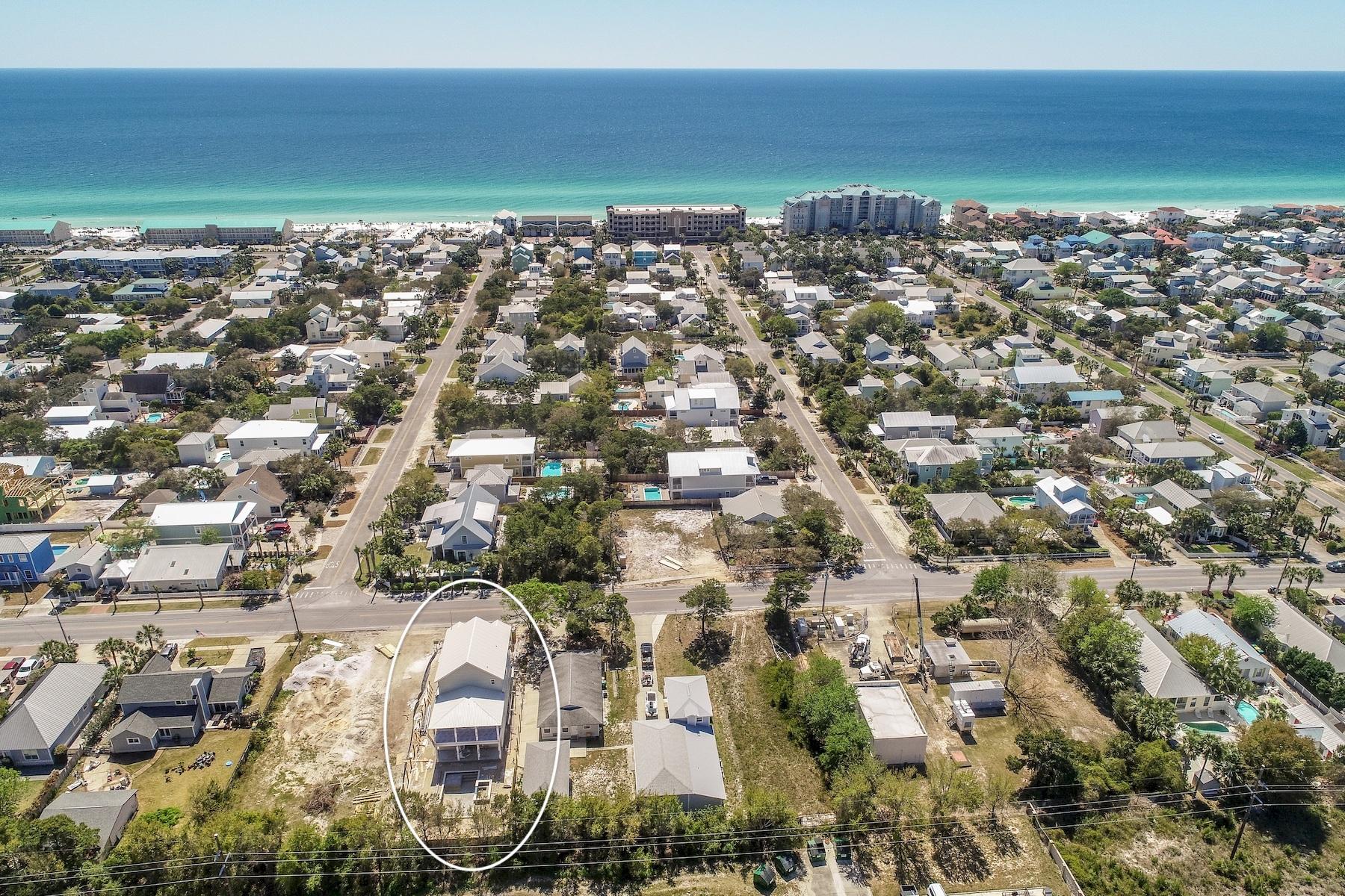 Excellent opportunity to enjoy new construction set amongst the backdrop of the white sand beaches and emerald green waters of the Emerald Coast. This extraordinary eight bedroom home is offered mid construction with ample opportunity to acquire before peak rental season offering +$200,000 in gross annual rental projections with an estimated completion date of early Summer 2019. Thoughtfully designed and masterfully built, this beautiful beachside retreat spans three vertical stories and is highlighted by it's coastal architectural aesthetic utilizing low maintenance, sustainable building products including hardi-plank siding and metal roofing. The open floorplan is beautifully designed with ample room for entertainment anchored by a massive first floor living room complete with a sizable chef's kitchen which flows directly onto the covered rear lanai complete with a private resort style pool and adjoining spa surrounded by fenced privacy and lush tropical landscaping. Each bedroom is configured to offer a full ensuite bathroom as well as immediate access to a living area including private covered porch space. The first floor layout offers two bedroom suites in addition to the living space. The second floor is comprised of four king suites each offering an ensuite bathroom as well as brief gulf views. The third level is complete with a large living space and bunk area as well as two spacious king bedroom suites, each complete with ensuite bathrooms and access to the south facing covered porch which allows for gulf views. This property is located in the heart of Crystal Beach and is highlighted by a direct path to public beach access as well as close proximity to world class shopping, dining, nationally rated golf courses and local entertainment.