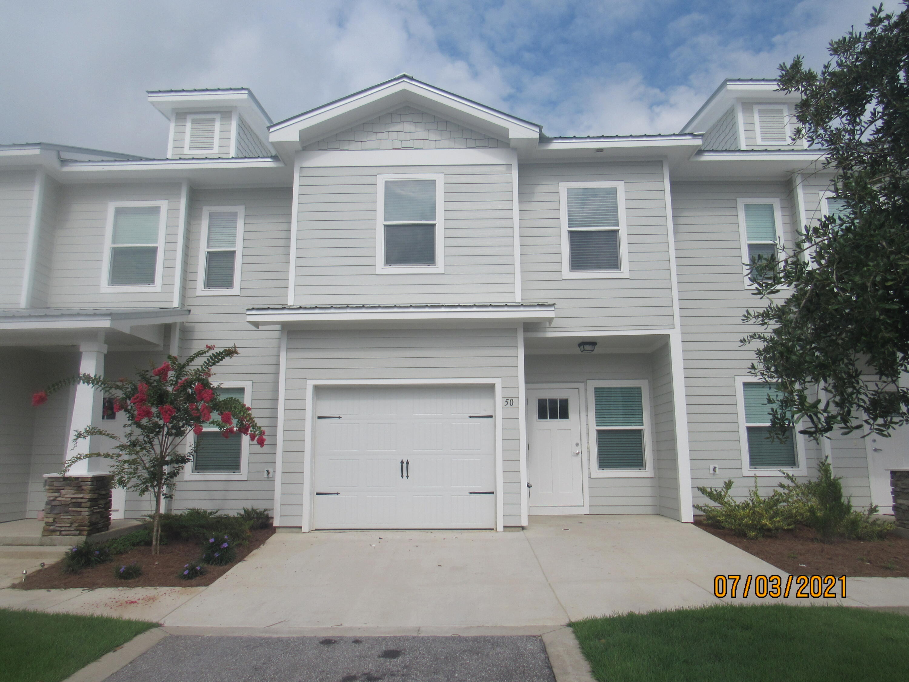 Beautiful 3-Bedroom Townhome with Garage & Community Pool - Prime Location!

Built in 2020, this stylish and upgraded townhome offers 3 bedrooms, 2.5 baths, a garage, and access to a community pool. Located just steps from the elementary school, a few miles from a Publix shopping center, and a short, easy commute to the sugar-white sand beaches and emerald waters of 30A/South Walton, this home is in an unbeatable location.

Inside, you'll find neutral paint and no carpet throughout for a modern and low-maintenance living space. The open-concept first floor features a spacious living room with a cozy nook, an eat-in kitchen with a breakfast bar, gorgeous countertops, a stylish backsplash, and plenty of counter and cabinet space. Stainless steel appliances, including a flat cooktop stove, add a sleek touch, while the pantry provides extra storage. A half-bath with a pedestal sink is conveniently located for guests, and the screened-in back porch offers a relaxing outdoor retreat.

Upstairs, the primary suite is a true escape with a walk-in closet and an en suite bathroom featuring a double vanity, soaking tub, and separate walk-in shower. Two guest bedrooms share a full guest bath, and the laundry hookups, with a washer and dryer included, add extra convenience.

This home offers plenty of storage and includes pool care, lawn care, and garbage in the rent. Pets may be considered on a case-by-case basis with prior owner approval and a non-refundable pet fee. No smoking or vaping is allowed.

Don't miss out on this fantastic rental opportunityschedule a viewing today!
