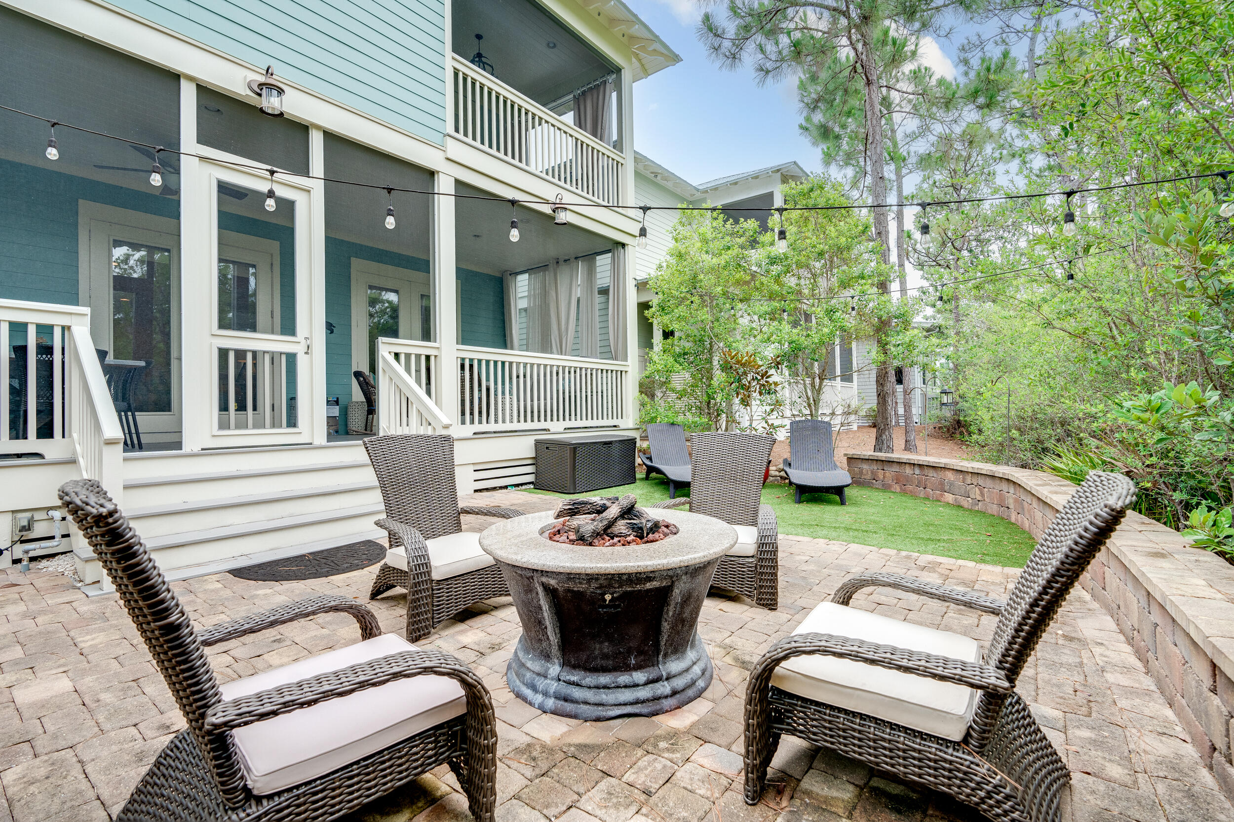 Welcome to this amazing beach chic home located in the highly sought-after NatureWalk at Seagrove neighborhood! If you're looking for the perfect blend of comfort, style, and entertainment, then this is the place for you.  Situated on the closest street to the beach, this home boasts one of the most popular open floor plans. What sets it apart is its larger lot size, allowing for a truly magnificent backyard. The custom design is a one-of-a-kind masterpiece, ideal for hosting gatherings and creating lasting memories. Step outside and be greeted by a built in grill, a fire pit table, a spacious paver patio, and even turf grass. All of this is framed by beautiful landscaping, with the added bonus of a private view overlooking the tranquil preserve. As you enter the home, you'll be captivated by the light, bright, and airy ambiance. Solid pine floors stretch throughout, complemented by fresh white paint and charming v-groove accents on the first floor. The double front doors open up to a cozy and private screened porch adorned with mature landscaping. Unwind on the bed swing and soak in the serenity. Inside, an oversized king bedroom with an attached bath awaits, providing ample space and comfort. The living, kitchen, and dining areas flow seamlessly in an open layout, ensuring plenty of room for both family and friends. The kitchen is a chef's dream, featuring top-notch white shrock quality cabinets, GE Appliances, a gas cooktop, built-in microwave and oven, and a vented range hood. The huge pantry closet offers convenient storage, while the living room boasts a gas fireplace, adding a touch of warmth and coziness.
When it's time to enjoy the outdoors, two French doors in the living room open up to an expansive screened-in porch, which leads to the backyard oasis. Upstairs the primary suite is a retreat in itself, complete with its own private screened porch overlooking the quiet preserve. The custom-designed master closet and trey ceiling add a touch of luxury to the space. Additionally, the large loft on the second floor offers a built-in bookshelf with a window seat and a set of bunks, adding a bonus space to the home.  2 additional queen sized bedrooms on the front of the house share a bath with double sinks. This home ensures relaxation and comfort with four screened porches accessible from every bedroom. 
The garage features tall ceilings, perfect for extra storage, and just inside the house, you'll find another storage closet, ideal for an owner's lockout.  
While this home has never been on a rental program, rental projections have been quoted up to $98,000, showcasing its exceptional potential. NatureWalk is a highly desirable community, located near Seaside, Watercolor, and just a short distance from the crystal blue waters of the Gulf. Plus, you won't even need to load up the car to enjoy it- a golf cart of bike will be just as easy! Just steps away from the house, you'll find the community amenity center, aptly named The Gathering Place. There's no shortage of activities within the community, as NatureWalk boasts two pools (including a heated lap pool in the winter), a hot tub, a kiddie pool, a fire pit, grills, a bar area, and a sports court with pickleball nets. Additional community amenities include miles of trails, fitness stations, and access to trails in Point Washington.
Don't miss out on the opportunity to make this exceptional home your own and experience the best that NatureWalk at Seagrove has to offer. Schedule a showing today and start living the beach lifestyle you've always dreamed of!