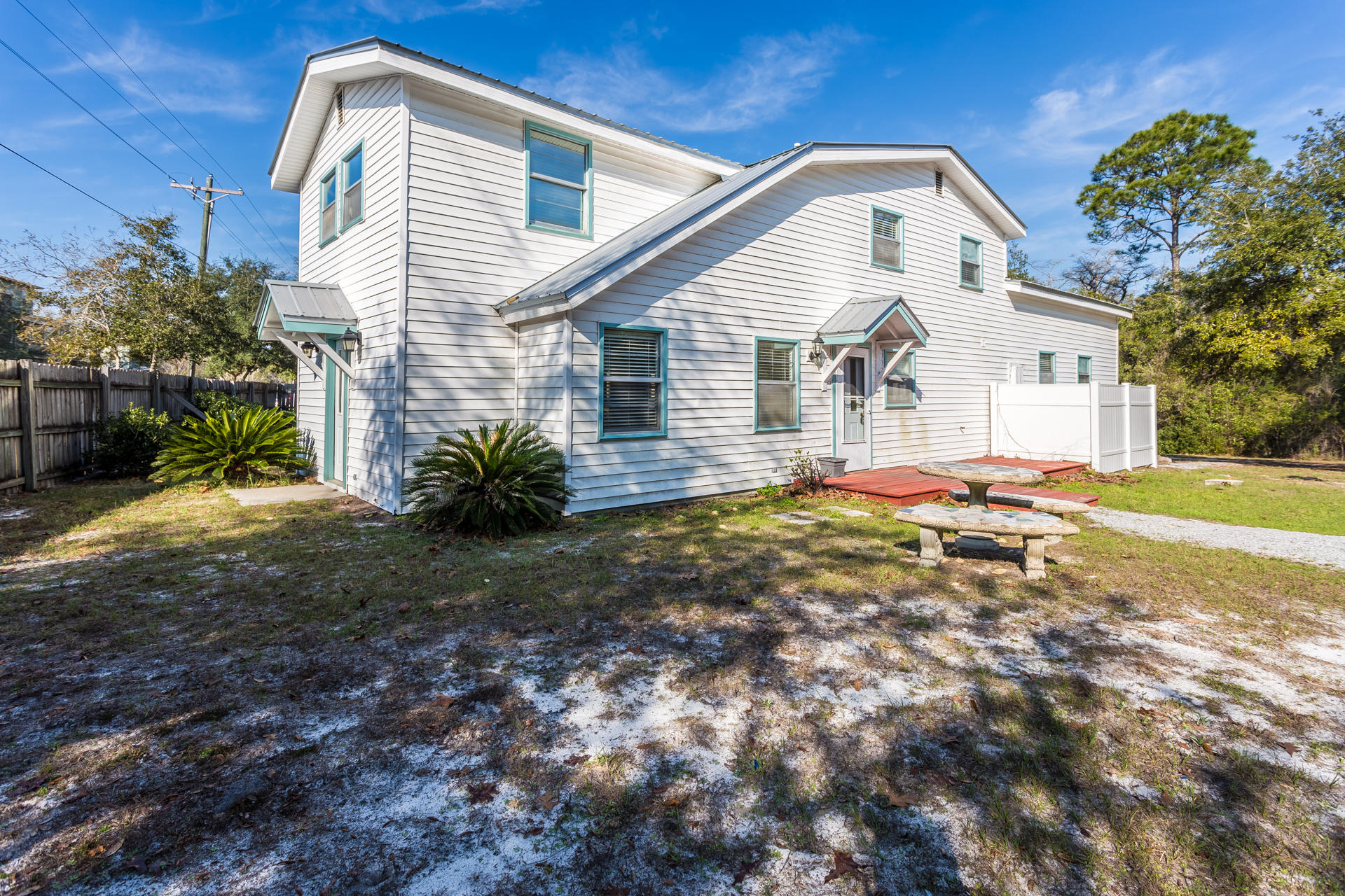 Location! Location! Location! This great property is located off Scenic 30-A and only 1/2 mile from Grayton Beach. This Beach House sits on a 1/2 acre with a privacy fence along the road. It has 3BR and 3 full baths with an office downstairs. Great place to entertain outdoors, and huge garage. Come see this one, as it won't last long! Tenant to verify all dimensions.