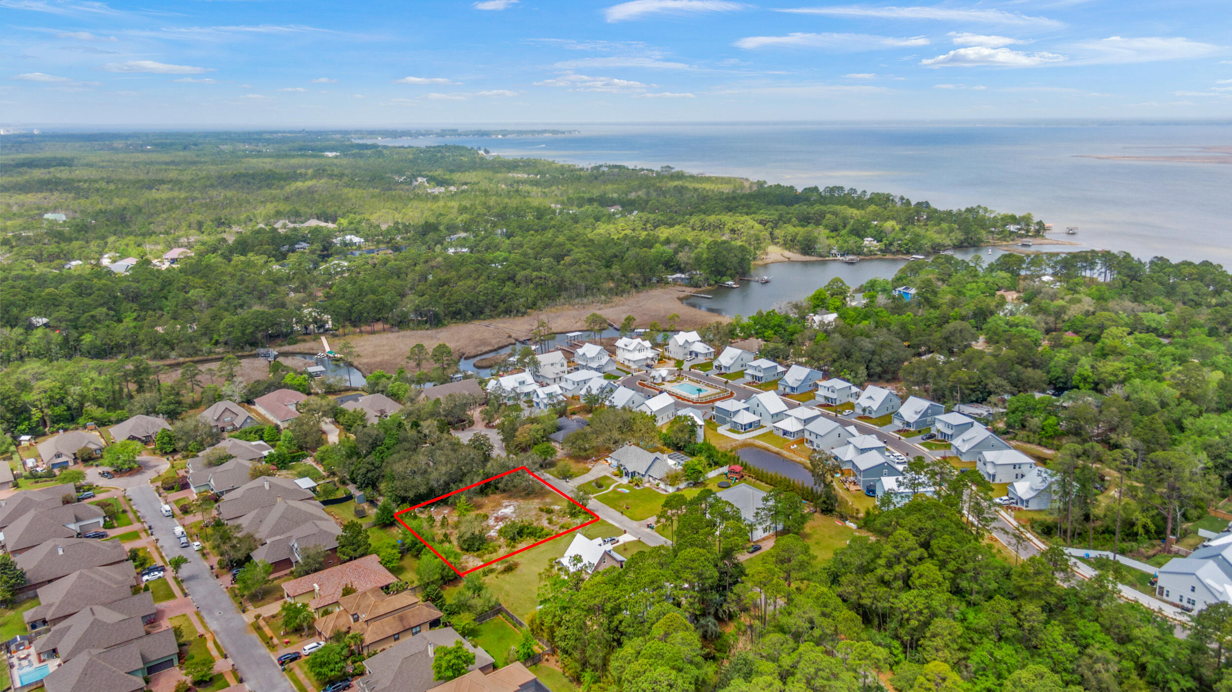 Large, cleared lot in the established neighborhood of River Bend.  Build your dream home and enjoy all the conveniences of Grand Boulevard, Sandestin and 30a such as shopping and fine dining as well as weekly farmers markets, events and fun family outings. The beautiful beaches of South Walton are just minutes away!