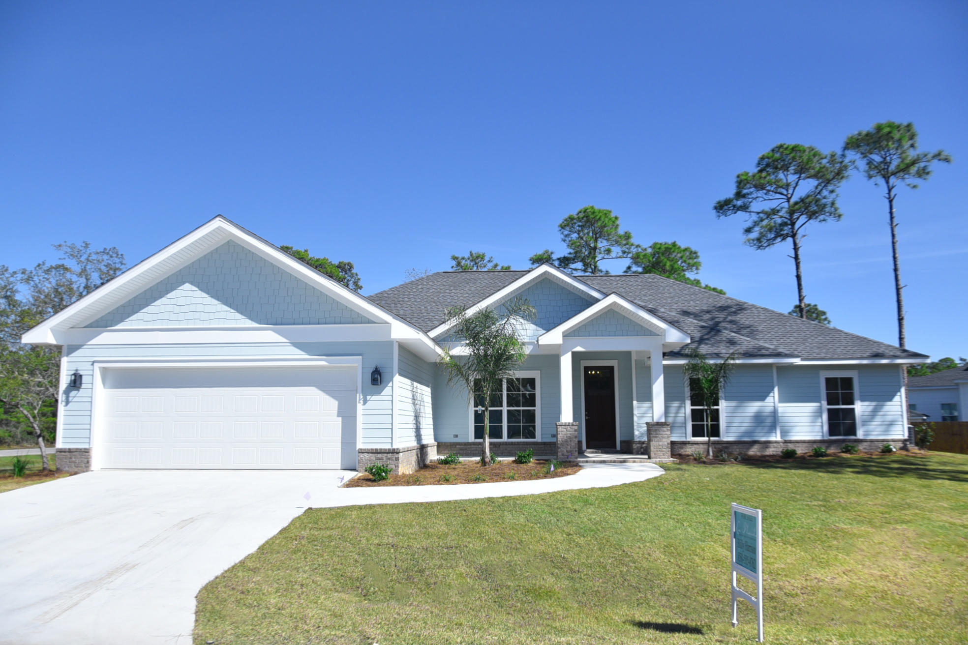 New Construction in Pelican Bay! If you are looking for a quiet, gated neighborhood with deeded access to the bay you have found it! And it's only minutes from restaurants, shopping, beaches and golf! This 4 bedroom 3 bath home is 2694 sq feet and has an open concept that is perfect for entertaining. There are many unique details from the shiplap foyer to the pecky cypress barn door. A must see!