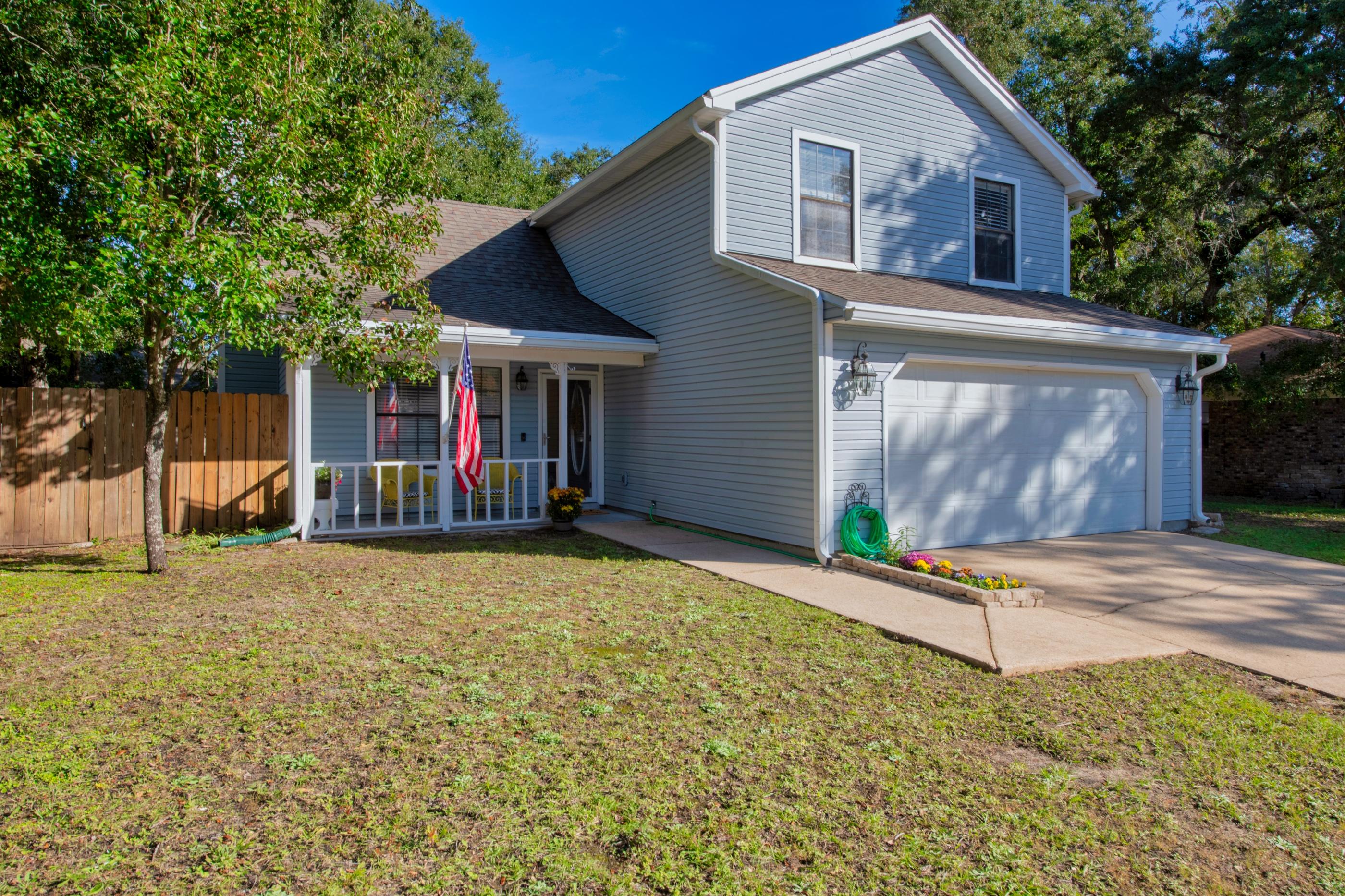 Located in the heart of Niceville, near the Niceville High School and walking distance to Lions Park this move in ready home is ready for new owners.  The inviting front porch is a perfect spot to relax or visit with neighbors.  As you enter the front door you are greeted by the vaulted beamed ceilings with a wood burning fireplace and new vinyl plank flooring.  The kitchen features white cabinets and new granite counter tops with a classic white subway tile backsplash.  The dining room overlooks the back yard which is fenced.  The large open composite deck in the back yard is perfect for enjoying nature and entertaining.  The spacious upstairs master bedroom has plenty of room for all your furniture.  The half bath and master bathrooms have both been updated with new countertops. The garage has lots of built in storage cabinets and there is a shed in the backyard.  The Seller is offering a home warranty with American Home Shield for the Buyer's peace of mind. The Seller also has a raised seal survey. Nearby  Lions park features a boat ramp, picnic tables and fishing.