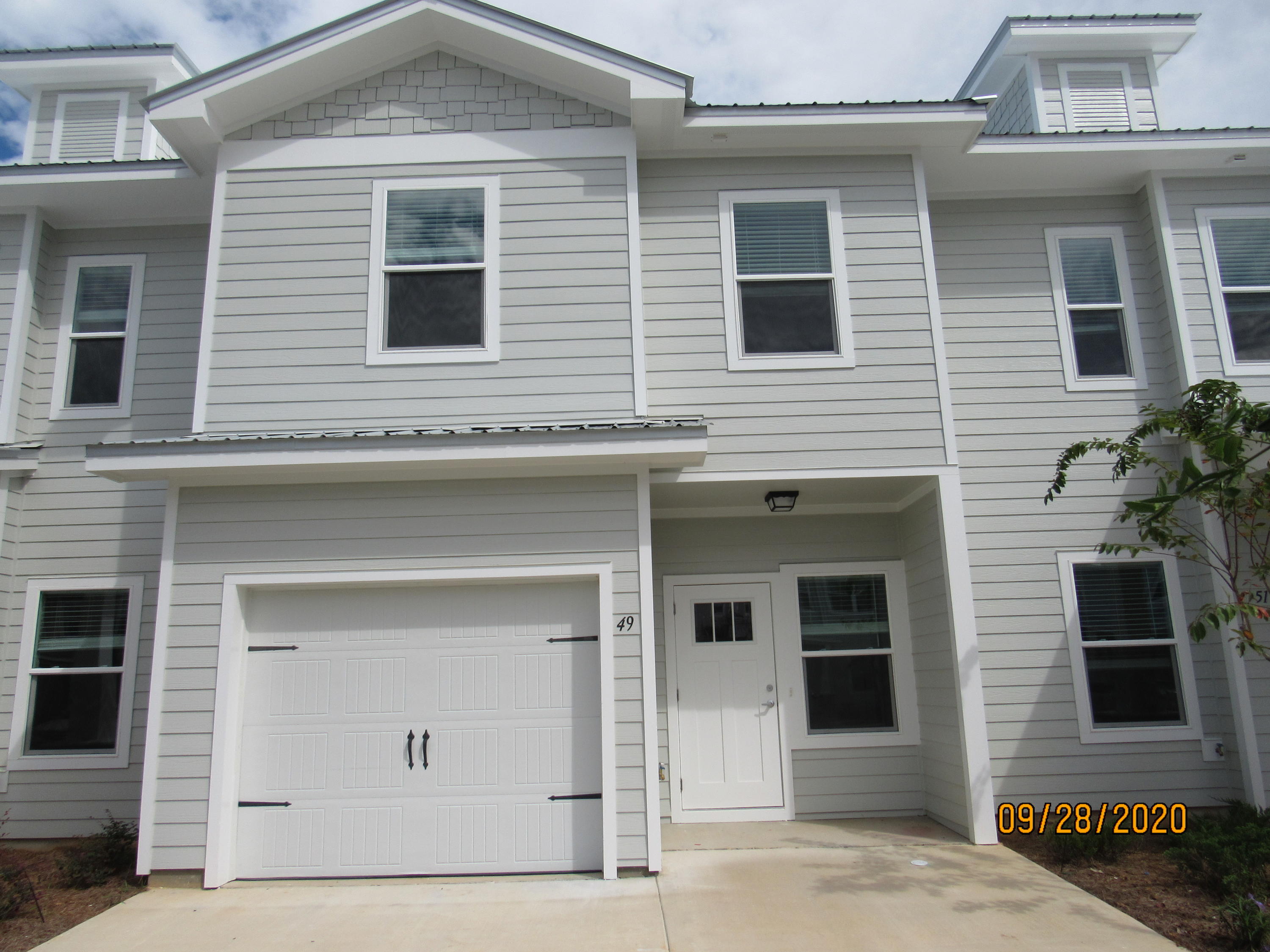 BRAND NEW, never lived in, 3 bedroom, 2.5 bath town home with upgrades, garage, and a community pool! This lovely home is across the street from an elementary school, just down the road from a Publix shopping center, and a short, easy commute to the sugar sand beaches and emerald waters of 30a/SOWAL. It has fresh, neutral paint and no carpet throughout. The open floor plan on the first level includes a nice size living room with nook, eat-in kitchen with breakfast bar, gorgeous counter tops, plenty of counter/cabinet space, stainless appliances (including a flat cook top stove), beautiful back splash, and pantry as well as a half guest bath with pedestal sink and a screened-in back porch. Upstairs, you will find the master bedroom, complete with a walk-in closet and en suite with double vanity, soaking tub, and separate walk-in shower, as well as two guest rooms sharing a full guest bath and the laundry hookups (washer and dryer included in rental). There is plenty of storage. Pool care, lawn care, and garbage included in the rent. Pets may be considered on a case-by-case basis with prior owner approval and a non-refundable pet fee. NO SMOKING.