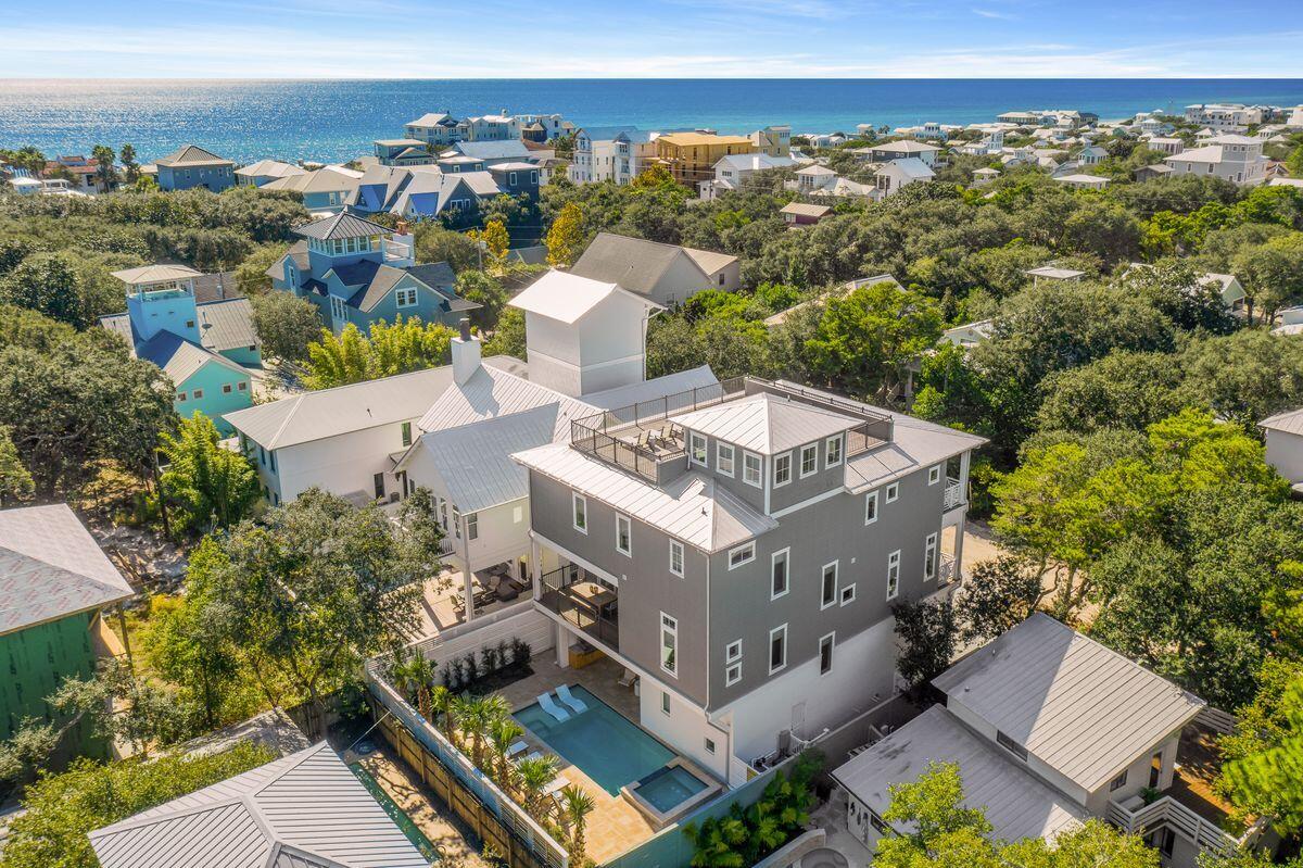 Situated in the heart of Old Seagrove, west of County Road 395, this exemplary new construction is characterized by ample open living space including a sprawling fourth story rooftop deck as well as panoramic water views with corridors of the Gulf of Mexico. Located only a few blocks from Seaside, FL, this home was recently finished and designed by Jennifer James Lyons of James Design Company and offers six bedrooms (plus two bunk spaces), eight baths and an impressive three story vertical footprint with open living space and resort style amenities including an oversized heated pool with adjoining spa surrounded by a lush, private outdoor living area. This property was designed as a legacy compound with multiple uses including the opportunity for short term rental yield as well as comfortable family living. Other notable features include a spacious garage, ample parking, private elevator and plush luxury finishes. Thyme Street offers excellent beach access less than two blocks away and close proximity to Seaside, Watercolor and all of the world class shopping, dining and entertainment that 30A has to offer.