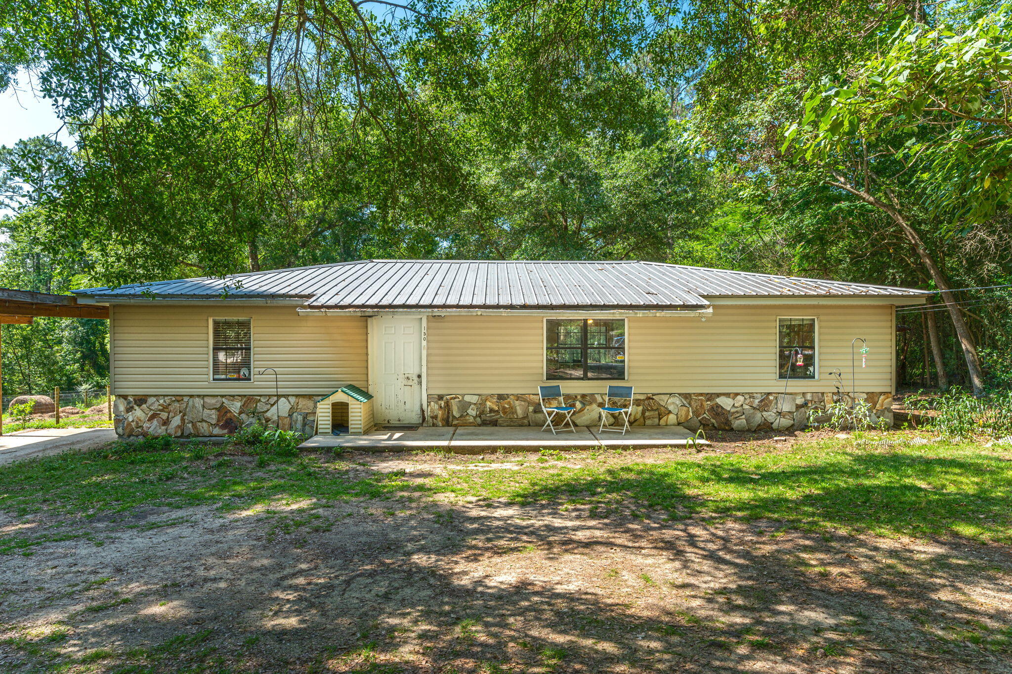 Under contract but taking backup offers at this time.....PRICED TO SELL QUICKLY!! Home has 3 bedrooms, 2 bathrooms, split floor plan, & sitting on just under a half acre that's located 1 mile from Lake Defuniak & the Historic District. With a little TLC, this place could be the perfect starter home or investment property. The kitchen has all real wood cabinets! Outside is a covered double carport attached to the house along with an outside yard building & a single carport for car or boat on the opposite side of the home. It's connected to city water & has a septic tank. Give us a call today to take advantage of the opportunity to own this home!