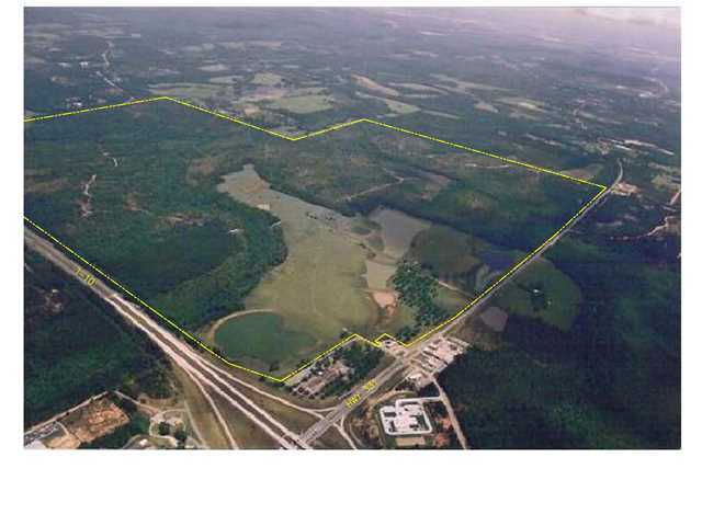 Rare opportunity for investors/developers to own a parcel of this size so close to Emerald Coast Beaches. Gateway property site in DeFuniak Springs, FL located at I-10 and Hwy 331, the major north-south connector to Emerald Coast Beaches only 30 minutes away. With over 2 +/- miles frontage on Interstate 10 and 1.5 +/- miles on Hwy 331, this 1400+/- acre parcel has unlimited development potential including commercial, residential, golf course, recreation, multifamily, manufacturing, industrial/cargo, alternative energy park. The surrounding area is mixed use and an above average location for a variety of commercial and other uses consistent with coastal oriented Walton County. Commercial consistent with neighboring properties. Water and sanitary sewer available from the City of Defuniak Springs and would allow for development of the site. Physical attributes of the property are adequate to support a broad range of construction alternatives oriented towards a future interchange oriented commercial use. Several lakes and ponds on property. Florida Dept. of Transportation is in process of widening U.S. 331 and will provide several new access points to property (details available upon request). This is an excellent development opportunity or buy / hold investment. Site is approx. 30 minutes Northwest of the Panama City International airport.