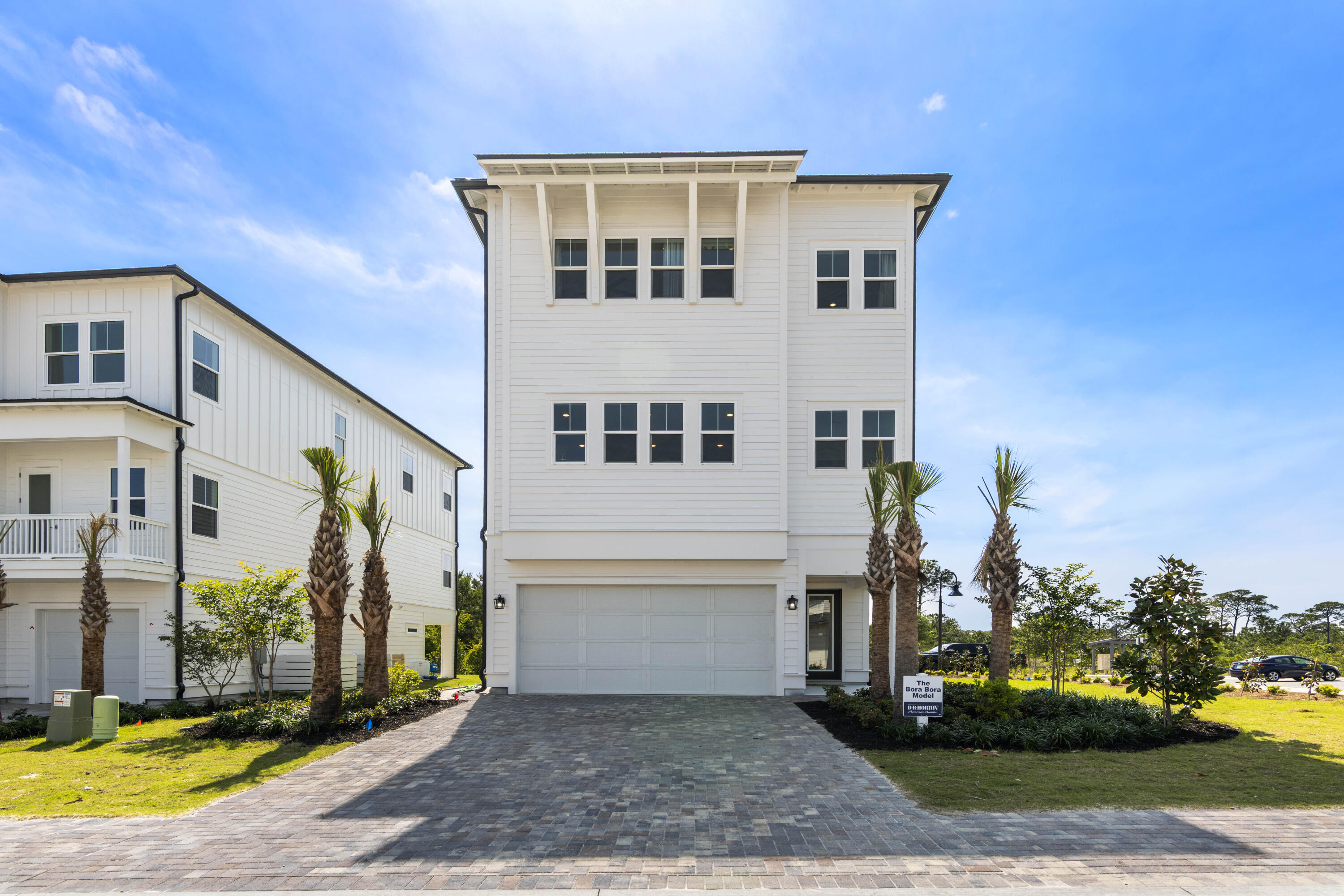 Bluewater Landing is the embodiment of 30A's laid-back and luxurious lifestyle. This intimate 31 home community has easy access to pristine beaches, clear waters, first class dining, and shopping. | Discover 'Bora Bora' at Bluewater Landing: a luxurious 4 bed, 3.5 bath home with 3,408 sq ft. Entertain in style with a spacious 2nd-floor living area, gourmet KitchenAid kitchen, flex space, 2-car garage, elevator, and hardwood floors. Enjoy stunning sunsets and beach access in Blue Mountain Beach.