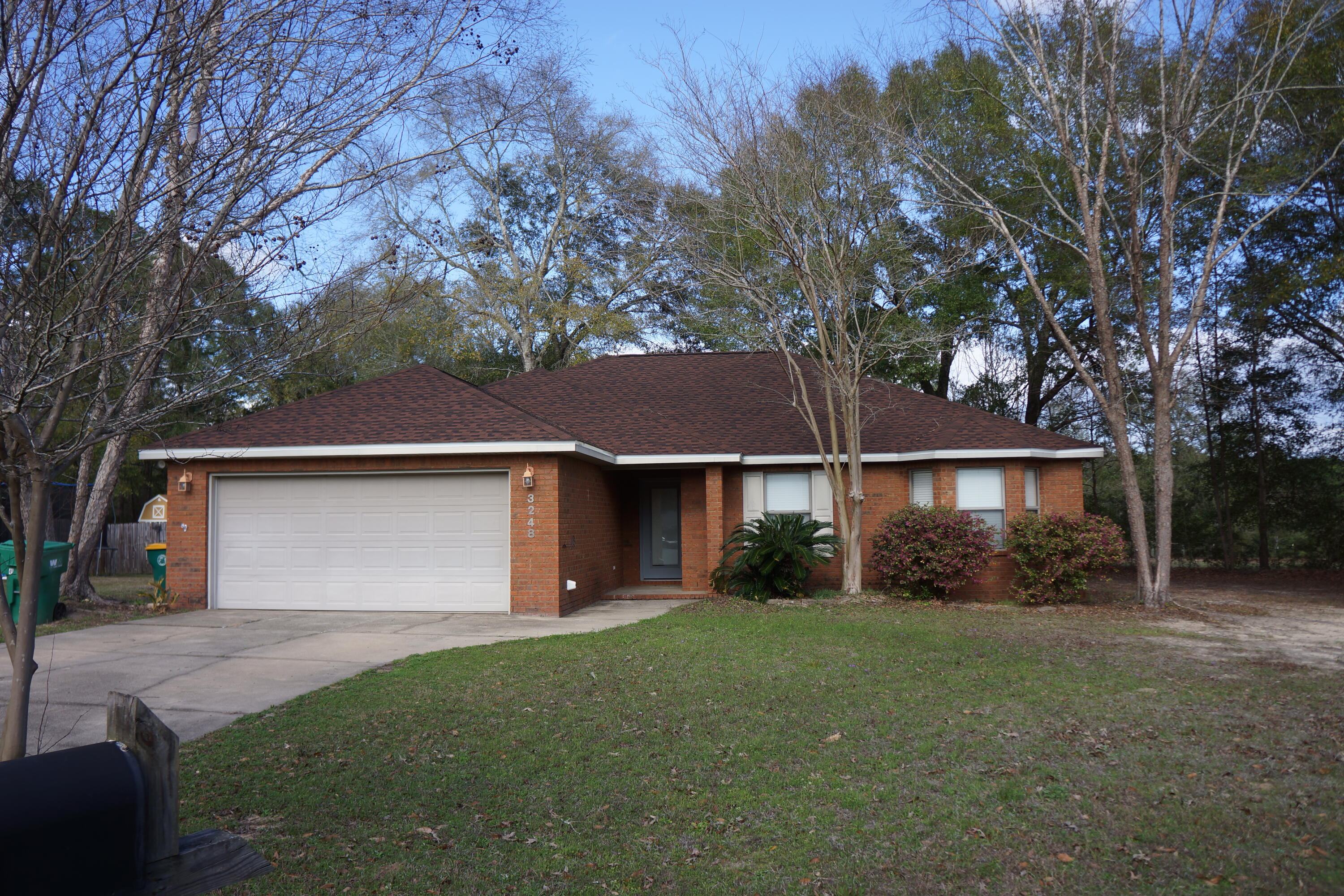 Price Improvement on this great all brick home in a quiet subdivision with NO HOA. The split floor plan offers 4 bedrooms, 2 baths, a new roof (2025), a spacious living room with raised ceiling. The kitchen has stainless steel appliances, wood cabinets with plenty of counter space and storage, plus a great lighted walk-in pantry. The laundry room is conveniently located between the kitchen and  the 2-car garage. The primary suite has a large bedroom with tray ceiling, ensuite bath with double vanity, garden tub, separate shower, and walk-in closet. The three additional bedrooms are generous-sized, have trey ceilings and one has a lovely bay window. The living room and primary bedroom each have French doors that lead to a deck and backyard. Existing survey available.
