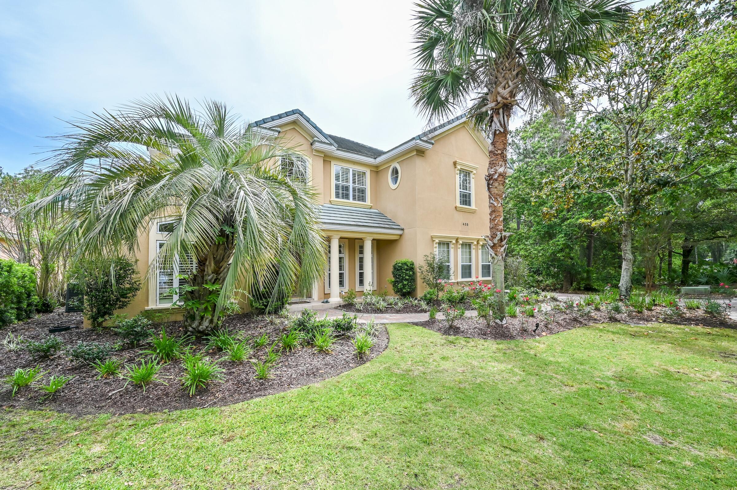 Beautiful Tuscan style home in the sought after gated Regatta Bay Golf & Yacht Club community providing 120 acres of protected nature preserve.  This home is just past the golf club house with golf cart access to Legendary Marine and Lulu's restaurant. This 4 bedroom, 3.5 bath home with master bedroom and main living areas on the ground level including a separate office/den.  Large updated kitchen with granite countertop serving area, gas stove, wine refrigerator, double ovens and large pantry. Includes a dinette and access to separate dining room area.  The living room, kitchen and master suite all open up to the back outdoor space. This inviting back yard includes a heated salt water pool, summer kitchen and recently rescreened enclosure.  There is a wooded buffer between you and ... the golf course providing serene privacy.  Perfect for entertaining or quiet relaxation.  This is one you want to see.