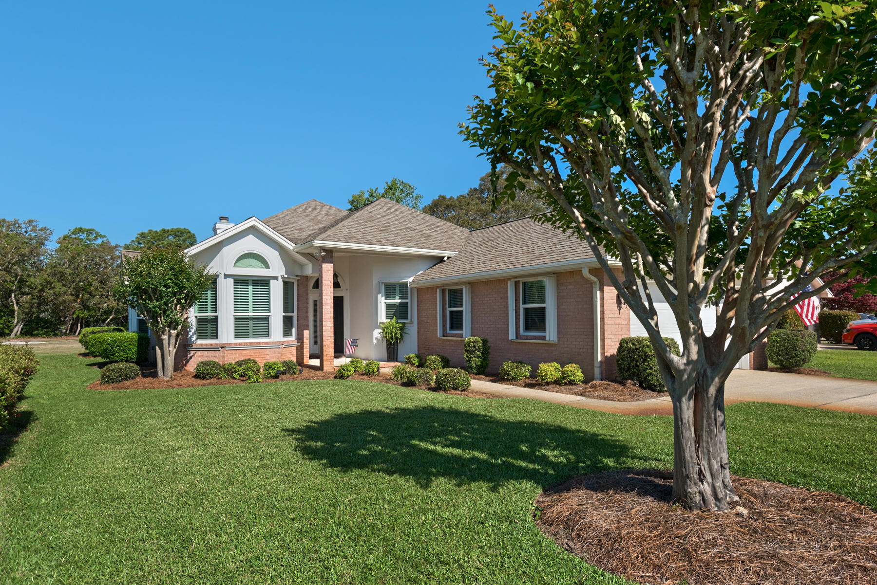Beautiful 3 bedroom 2 bath, custom built home in the highly sought after Shalimar Pointe Subdivision. This extremely well maintained and loved home is located on the 3rd fairway of the golf course. Open floor plan with high ceilings, amazing light and plantation shutters throughout. The great room has a gorgeous gas fireplace centrally located between the dining and living areas. The updated eat-in kitchen is large with lots of natural light from the bay window, complete with stainless steel appliances. Storms are not a problem with this house as it has a whole house generator and all the windows have been updated with impact glass to include the slider. The professional landscaping is immaculately maintained. Come see for yourself.  You don't want this one to slip away.