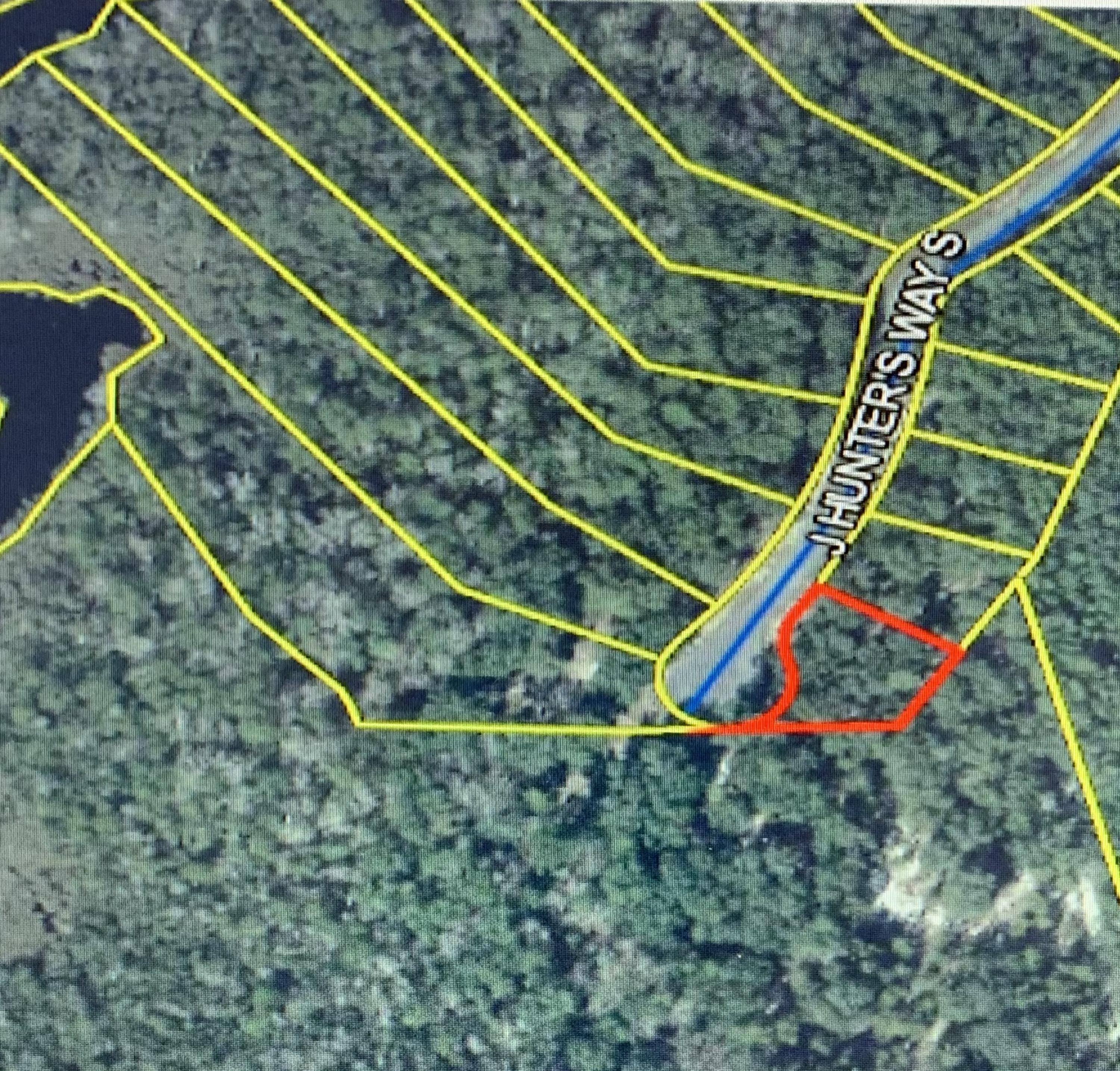 Beautiful large wooded lot in Magnolia Bay Estates.  This subdivision is located just off Bay Loop Road and is ready for your dream home.  Magnolia Bay Estates is a waterfront community located on Goodwin Creek that leads out to the bay,