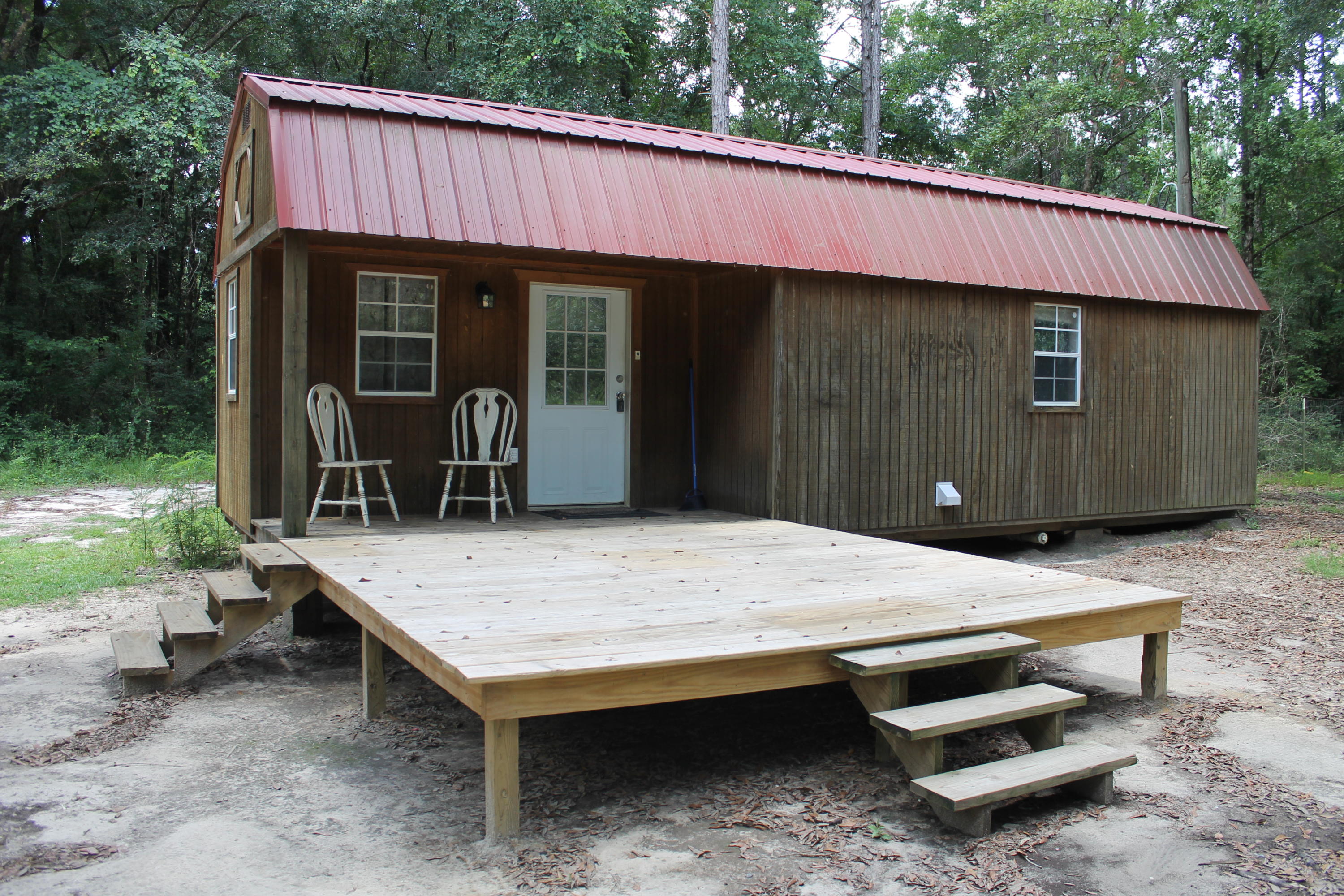 Welcome to Blackwater Forest! This beautiful 12.5 acre property offers a wonderful quiet get away and would make a great hunting camp due to the shared boundary with the Blackwater Forest. This well priced property is located on Eadie Cotton Rd less than 1/2 mile from the popular Peaden Bridge swimming hole! No need to bring a tent or camper. With a great 1 bedroom 1 bath lofted cabin already in place you can camp and hunt on the property as well as enjoy fishing, swimming just a short walk/ride down the road. Along with the cabin, the property also has nice shed for your ATV or boat as well as a chicken coup.