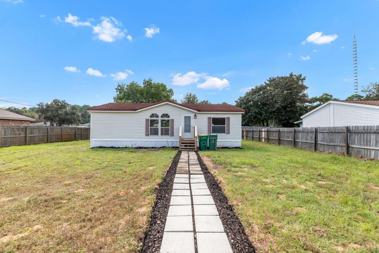 Welcome to this beautifully updated 2006-built mobile home on a .22-acre lot in Mary Esther! Just a few miles west of Hurlburt Field, this property is tucked away at the end of a quiet street, offering privacy and comfort. Inside, you'll find: *A brand-new kitchen with modern appliances *Fresh paint throughout *New flooring, fixtures, and doors *2 spacious bedrooms, each with its own full bathroom *The home also features a tiled roof for durability *Backyard complete with a storage shed. Whether you're looking for a starter home, downsizing, or investing, this one check all the boxes. Don't miss your chance to make it yours—schedule a showing today