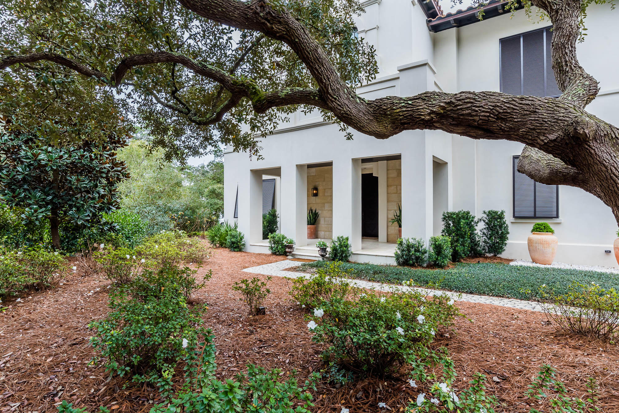 This exceptional home is set among a cluster of Sand Oaks in the private and tranquil gated lakefront community of Redfish Lane. This community offers a deeded beach access and is rental restricted. The towering mahogany door opens to unveil an interior and exterior oasis. You will feel welcomed by the spacious entry as your eyes move forward through the cozy loggia featuring a summer kitchen, fireplace and spacious living/dining area with a retractable screen. Look further and be drawn to the pool, fountain and courtyard framed perfectly by the beautiful oak trees and various areas to lounge and entertain.The entry level of the home also offers 4 spacious bedrooms each with a private bath plus an additional powder room. A two car garage complete with a sand room and extra storage. An elevator services all levels. The gracious staircase leads to the library with its built in bookshelves and large arched windows. The second level offers a sprawling open concept design flooded with natural light. The living area is a comfortable space with a grand fireplace and trayed ceiling and large windows affording expansive views of the pool and courtyard.The dining area is open and provides room for an oversized table. Enjoy the open chef's kitchen with its luxury appliances and abundance of countertop space complete and a large pantry. The perfect setting for entertaining. Beyond the breakfast area you will step onto a spectacular treetop screen porch for dining and relaxing complete with a fireplace and stairs leading to the pool. The master suite ,also located on this level, provides a serene view to the pool and courtyard. The master bath boasts a spa-like retreat with its massage tub, steam shower and an expansive walk-in closet.
Seller is a licensed real estate broker.