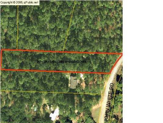 This is a great property totaling just over 1 acre close to town. The property is level and adjacent to the paved road. The wooded parcel has a 2 story shed/out building already in place. Build you new home here. Seller is motivated and will look at offers.