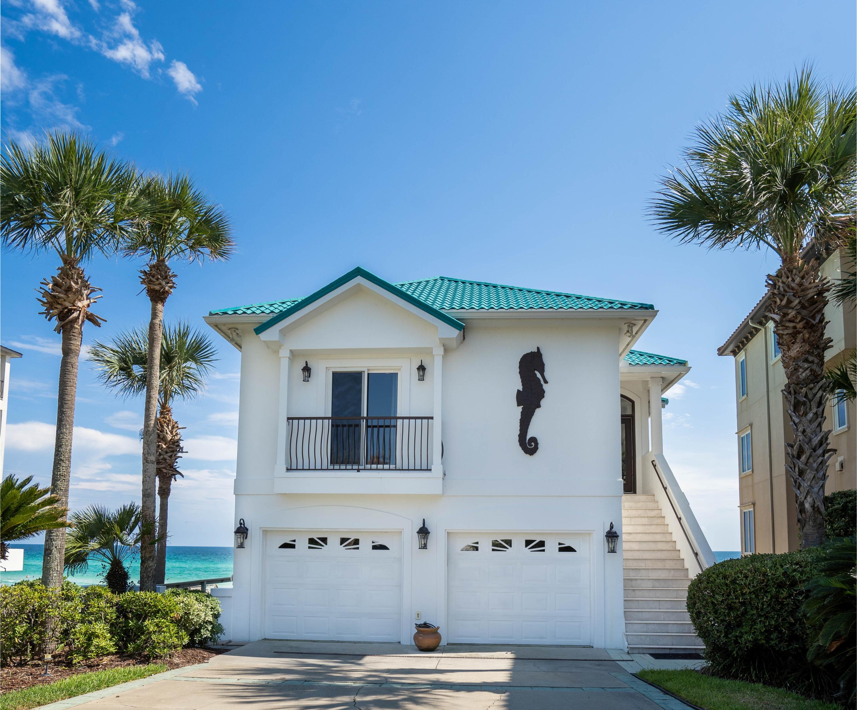 LOCATION, LOCATION, LOCATION! GULF FRONT HOME WITH 50 FEET OF PRIVATE BEACH! Few properties have the charm and solitude that surround this home. Step inside and you'll be amazed at the open layout. This home is ideal for entertaining. The kitchen, living and dining area boost a beautiful, direct view of the Gulf on the top floor of the home. The master suite also faces the Gulf with a luxury en suite bath and Jacuzzi tub. There is a second bedroom and laundry on the top floor also. The middle floor plan allows privacy for your guests with their own living area and kitchenette. You will also find two bedrooms with a jack and jill bath on this level.   On the bottom level, which has a completely separate entrance than the other two floors, has a large open room, with a kitchen, full bath, including a walk-in shower, two murphy beds and two large storage rooms. There are expansive balconies on the middle and top levels and a large deck on the bottom level, allowing for beautiful, never-ending views of the Gulf! This is a perfect forever home or a rental home, great for weddings also! County site shows the vacant lot next door as part of this property but the Seller has split that lot off and it will not be part of this sale.