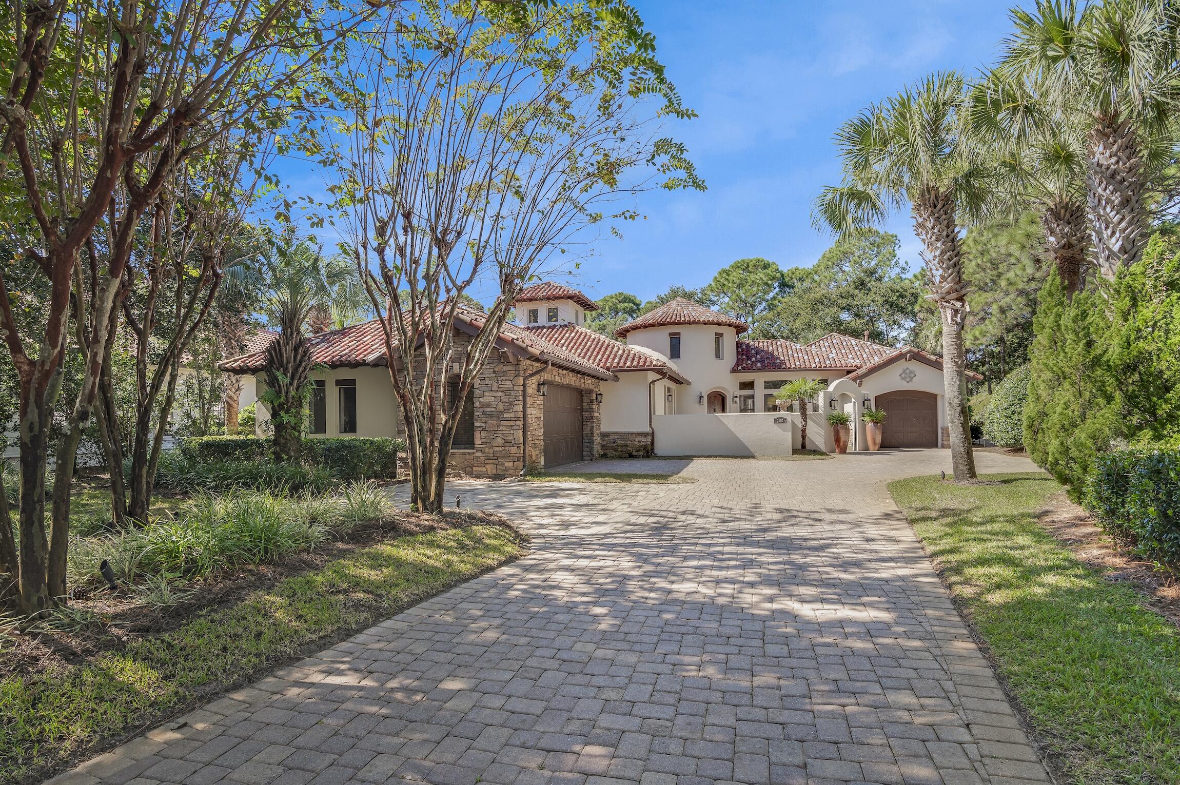 This exquisite custom-built, sprawling, single  story home is truly one of a kind. Tucked away on a prime, estate sized lot and cul-de-sac, located in the gated neighborhood of Burnt Pine and on the 2nd tee box of the Burnt Pine Golf Course, is a Tuscan inspired treasure. At   3,949 sq. ft., 3 beds, 5 baths, plus office, built by Sweet Homes as the builder's residence, the finishes are beautifully extraordinary. The many authentic wooden beams and wood planked ceilings are a timeless feature and from the illuminated brick covered barrel hallway ceiling to the stone accent walls, it is a showplace of craftsmanship and architectural design.  Enter by an arched courtyard gate that leads to a tranquil, cascading fountain.  The grand foyer, with its impressive twenty foot turret wooden ceiling is simply stunning.  With a popular open floor plan, the kitchen flows out to many rooms including the spacious dining room, suitable for an elegant dinner party with its a stone gas fireplace, beautiful hardwood flooring, attractive custom built-ins, vaulted wood ceiling and with views and access to a side courtyard.  The wine room, with its pretty iron gate, breakfast nook, double door pantry, oversized granite island, perfect for serving and entertaining, are all part of the kitchen. The unique three-sided, stone, gas fireplace that graces the kitchen, breakfast nook, and living room adds lots of charm and seasonal warmth during the cooler evenings.  A stone arched way and brick accented walls are also found in the kitchen, along with wooden beamed ceilings and many bronze iron lighting fixtures.  Custom, pecan-stained wood cabinetry and millwork are all high-end features found throughout the entire estate the along with 12 foot and taller ceilings.  This gourmet kitchen is not only functional, but lovely.  It overlooks the large, heated, salt water pool, spa, and wall of fountains.  It is the heart of the home with its stainless appliances, including a Bosch dishwasher, a built-in, oversized GE Monogram refrigerator freezer, five burner gas stove with hood vent, warming drawer, double wall ovens and microwave.  The home has a built-in sound system in most rooms.  Enter the the grand living room and find hardwood flooring and the same pecan-stained wood entertainment center.  The ceiling in the living room is showy with more of those eye-catching beams and shiplap styled woodwork and another fabulous, iron lighting fixture.   Like the dining room, the living room can easily accommodate the entire family during special occasions, but cozy enough for just two.  The walls of sliding glass doors found in the living room stack open presenting a seamless appearance between the indoors and outdoors.  They allow access onto the spacious, and recently re-screened outdoor living, dining, lounging, heated pool, spa and wall of fountains.  The home wraps around the pool and fountains as it is the focal point.  Also found there is the outdoor kitchen which includes a serving island, new Thor double stainless refrigerated beverage drawers, and a new Thor ice maker, a built-in Viking gas grill with a vent hood, more custom cabinetry for added storage, another stone, gas fireplace with wood mantle, TV cabinet, a shiplap ceiling with many beams and six ceiling fans.  It's a fabulous place to gather and dine while enjoying our wonderful weather.  Or just relax, read a good book and let stress melt away.  It accesses a full bath and includes a storage closet.  It's important to note that the similar sized lot and adjacent to the home recently sold for $900,000.00.  Moving back inside, you will find the master en-suite which overlooks and accesses this great outdoor living area.  It really is a special retreat with two full baths, his and hers, a large walk-in/through closet, with many built-in cabinetry, and has a coffee/wet bar with a mini fridge.  In keeping with custom features, a trey ceiling, those beautiful hardwood floors and the custom pecan-stained wood cabinets are present.  One master bath has a double vanity, a large shower, a free standing spa bathtub, water closet, and a linen closet.  The other bath has a shower, single vanity, toilet, and with access to the pool and spa.  Designed with a split floor plan, the two guest suites are on the opposite side of the home offering privacy for all.  These spacious en-suite guest bedrooms not only have their attached private full baths, they include the hardwood flooring and both have walk-in closets.  One guest suite accesses the fountain courtyard for private entry and exit, and the other guest bedroom suite views the side courtyard.  The executive office continues with a wall of custom cabinetry for electronics and books, wood flooring, and even has a hidden safe room.  The office looks onto and accesses both the front courtyard, for a private entry and exit, and the screened outdoor living area, pool, and the fountains with its trickling water falls that can be heard if the glass doors there are open making it a peaceful working place.  The laundry room includes a stainless sink for washing out those sandy bathing suits or giving Fido a bath, and the full sized washer and dryer do convey.  There is a security system, central vacuum cleaning system and the home can be entered through the attached two car garage. There is also a separate golf cart garage.  No detail has been overlooked here.  There is also beautiful landscape lighting on a timer.  The exterior has recently been painted with an attractive, off-white shade of Rhino-shield paint, good for many years, two of the three HVAC systems where replaced in 2020 and 2022 with American Standard units, and the two new Navien, tankless, gas hot water heaters were replaced in 2022 along with the GE Monogram microwave oven.  There is also a transferable termite bond in effect for peace of mind.  Do not miss viewing this one, it will not disappoint.