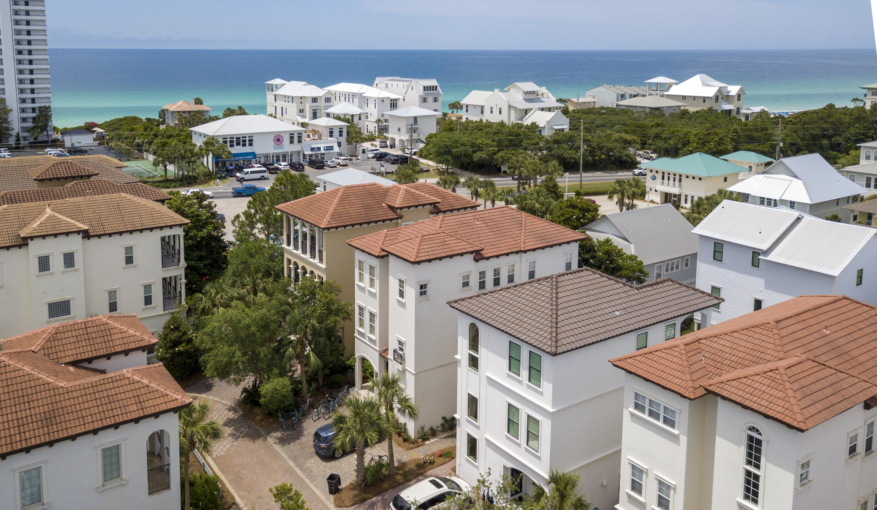 *Under-Contract with Kickout* Located behind the private gates of Palmeria Villas at Seagrove, a Mediterranean beachside development resides the luxury residence of 148 Palmeria. This gorgeous villa offers 4 master suites, a covered cabana pool, high ceilings, 2 living areas, and is located only 600 feet from the beach! The first floor offers a grand living area with an abundance of natural light, a kitchen/dining combo with coppered ceilings, designer furnishings and access to the covered pool featuring Brazilian ceilings, a wet-bar, bathroom and access to the back yard. Winding up to the second level you are greeted with a bunk room, an additional living area  w/en-suite (which easily be converted to accommodate a 5th bedroom), and a custom built-in seating area with storage. A master-suite with French doors, a walk-in closet and en-suite is located on the western side. The third floor is bright and airy and boasts two master suites with spa-like en-suites, and a sitting area - with the main master offering gulf views and ocean breezes.

This beach home is offered fully-furnished with an established and strong rental history. Palmeria Villas is nestled a mile and a half from Seaside, is across from the beach access, and centrally located near all the world class shopping and dining venues. A cost to own, feature & finish list is available upon request. Please inquire today.