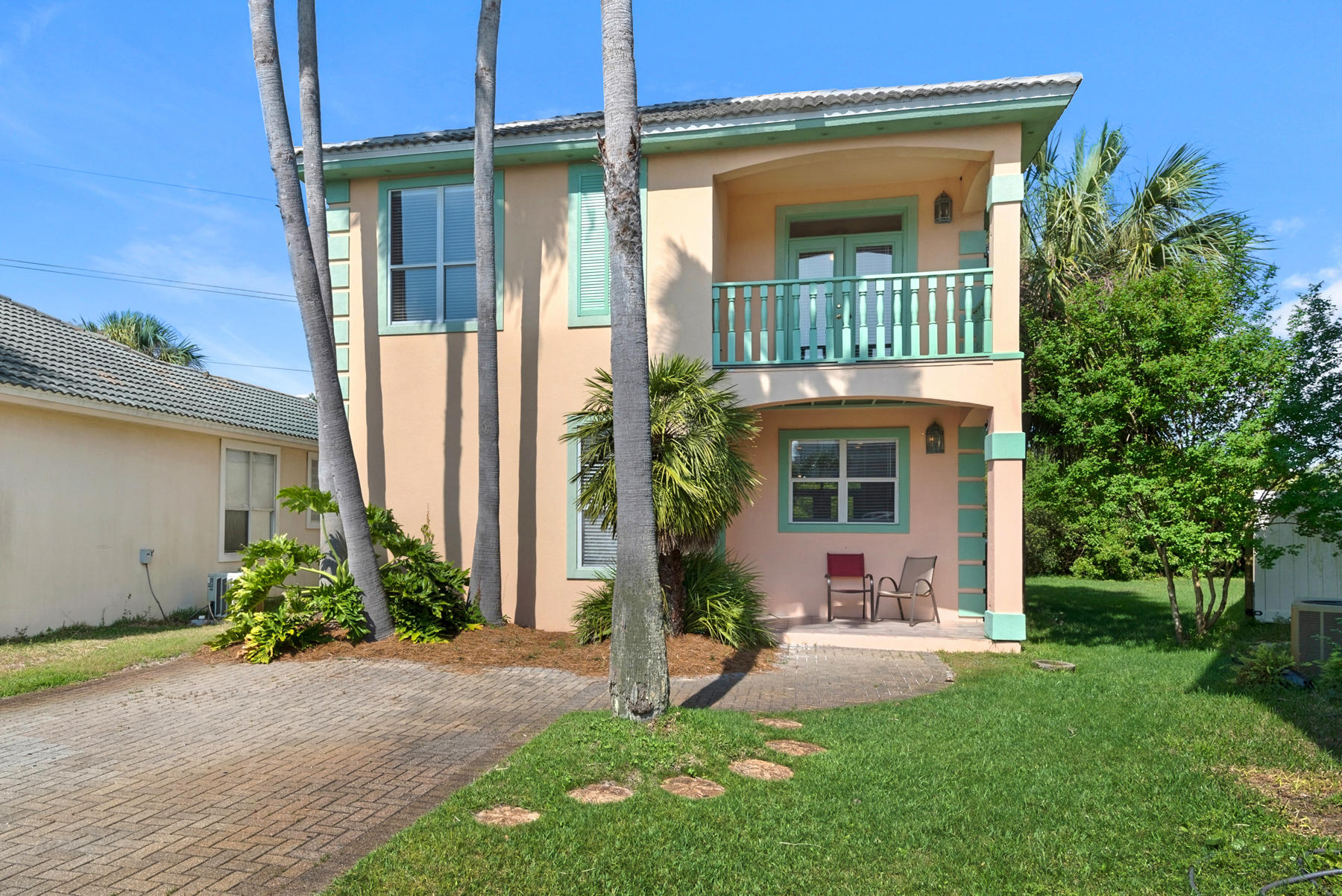 Bright and cheery 4-bedroom beach cottage is supremely located on a tropically landscaped cul-de-sac in Terra Cotta Terrace, a charming, low-density vacation community hugging the borders of Destin and Miramar Beach. Onsite amenities include a private community pool, sand volleyball court, tennis, and deeded beach access. Located on an especially private lot within the private community, ''Sea Peach'' offers a surprisingly relaxing reprieve right in the middle of the area's most popular restaurants and attractions. The private beach is just a short stroll away. Fun colors, an open floor plan, breezy balconies, and tile floors typify the ultimate beach home. The kitchen is open with new appliances, breakfast bar, and plenty of workspace. With updates, annual rental projections exceed $45K.