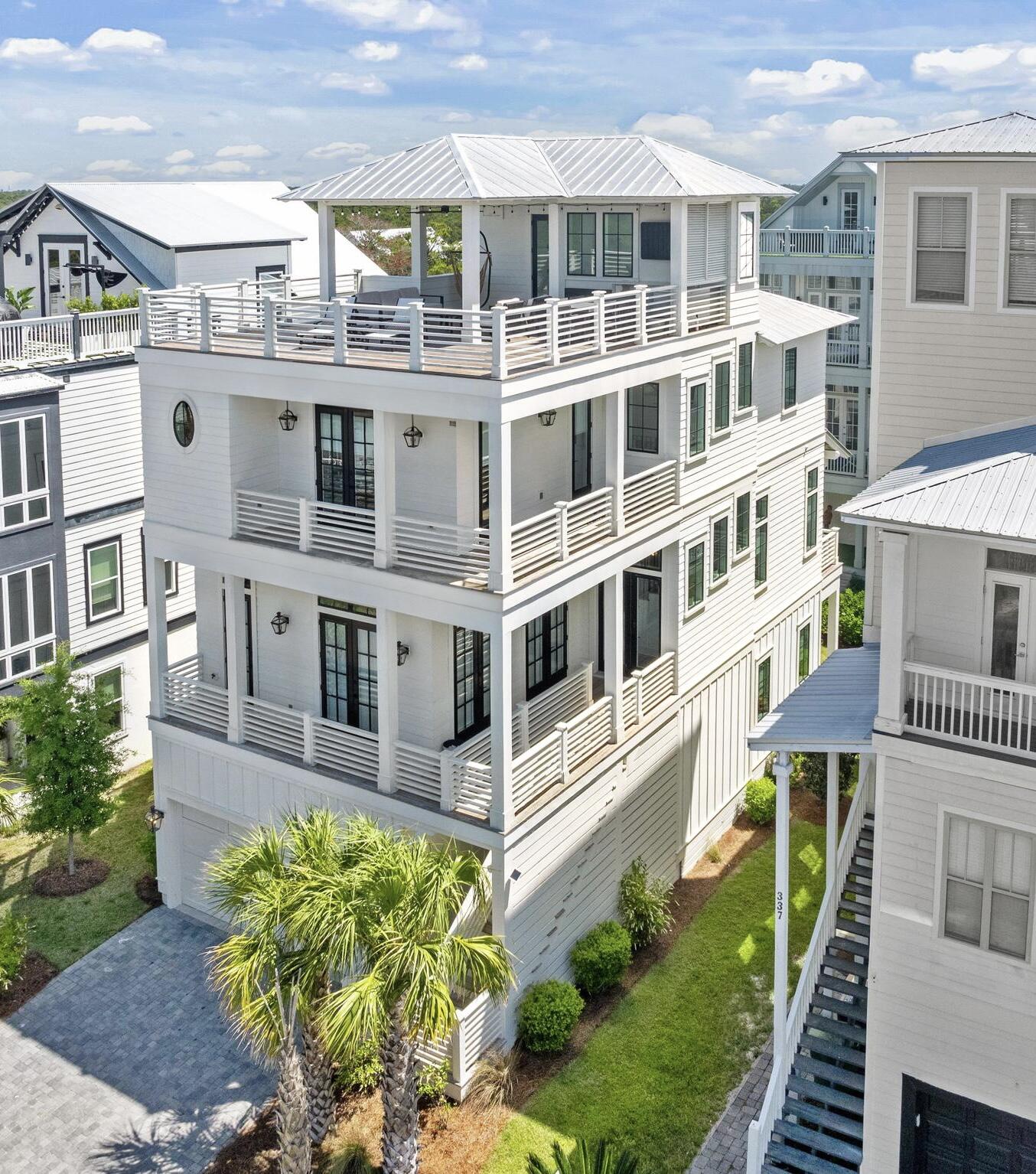 Welcome to 327 Grande Pointe Circle. A showstopping four-story custom coastal retreat offering over 3,300 square feet of professionally designed interiors, panoramic Gulf views, and effortless access to the best of 30A.
This turnkey, fully furnished residence features a first floor in-law suite with a separate living space and wet bar, an elevator, multiple indoor and outdoor living areas, and an oversized garage complete with an e-car outlet.
The crown jewel of the home is its rooftop deck, delivering breathtaking vistas of the Gulf, a wet bar and features both covered and uncovered areas perfect for alfresco dining, Sunbathing and stargazing
The chef's kitchen flows seamlessly into a bright, open living and dining space with refined finishes and curated coastal lighting and decor. Grande Pointe's resort-style pool, dock, and clubhouse overlooking Lake Powell is the perfect location to soak up the Florida sunshine 
And this home is located just steps from the sand and minutes from Rosemary Beach, this home is ideal as a luxury rental investment, a full-time residence, or a vacation haven.