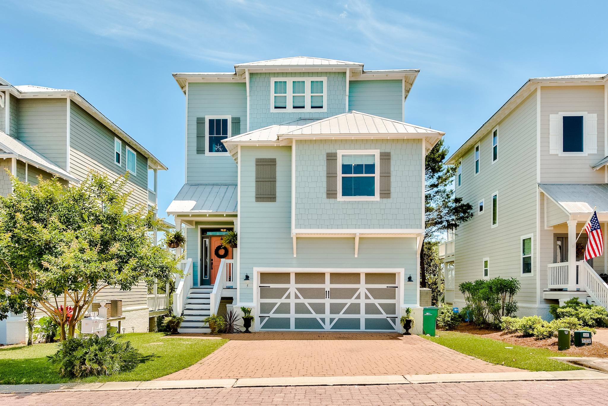 Incredible three story beach house with views of the Gulf from the third level! When looking for both location and an incredible primary residence or rental investment, this home has it all. This beautiful home is located just off the east end of iconic 30A in desirable Inlet Beach and only minutes from the largest beach access in Walton County (Orange Street), 30 Avenue for shopping & entertainment, Camp Helen State Park, and Rosemary & Alys Beach. The home provides the perfect setup for outdoor entertaining with large decks on each level. Boasting 2,843 sq ft, this home features 2 bedrooms on the first level, a bedroom on the second level, and a third level master retreat encompassing the entire third floor with views of the Gulf from the master bedroom and balcony. Beautiful hardwood floors extend throughout the entire home with tile floors in the bathrooms & laundry room. The first level offers two spacious bedrooms both with direct access to a large shared deck via French doors, a full bathroom with a walk-in tile shower & granite countertop, a flex space and a large laundry room. The common areas are located on the second level along with a third bedroom and full bath. The spacious living area has great natural light as well as recessed lighting. The open dining area features a beautiful tray ceiling and direct access to a large deck with a portion of it being screened-in. It is perfect for entertaining! The kitchen offers Quartz countertops, beautiful cabinetry, pot filler, a sink in the island and an island/breakfast bar, stainless steel appliances & range hood, and a pantry. The entire third level encompasses the master retreat. The spacious master bedroom features a lovely tray ceiling and is lined with windows offering fantastic views & great natural light. Just off the master bedroom is the sitting room perfect for a home office, reading nook, or even a home gym. The master bath features double vanities with granite countertop, large soaking tub, a walk-in tiled shower and an oversized master walk-in closet. 

The low HOA fee includes the amenities at Grande Pointe which offers a lakefront pavilion and nature paths leading to Lake Powell, the community dock, and swimming pool. The lakefront pavilion features a community room with a full kitchen and conference room, perfect for group gatherings. Just behind the pavilion is a large swimming pool and private dock leading out to Lake Powell. Camp Helen State Park is nearby and also offers a boat ramp with access to Lake Powell and fun outdoor activities such as swimming, kayaking, paddle boarding, nature study, hiking, and both freshwater & saltwater fishing can be enjoyed at the park. With the largest public beach access in Walton County (Orange Street) only a short drive away, you'll be relaxing on the pristine beaches with your toes in the sugar-white sand in just minutes! Whether this is your primary residence or vacation getaway, this is the ideal location to enjoy your days along the beautiful Emerald Coast!
