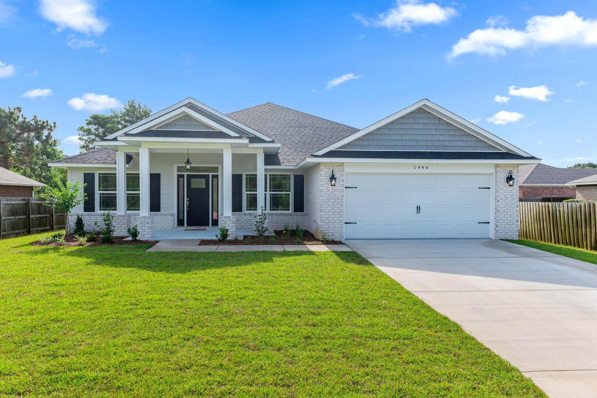 Welcome Home! This is an all brick 5 Bedroom, 3 full Baths, 2236 square foot home in Santa Rosa Shores East. This split floor plan home features a spacious great room, dining area and a large kitchen with granite counter tops, soft close cabinet drawers, tile backsplash, smooth top stove, built-in microwave and dishwasher. The home has luxury vinyl plank floors in the Great room, Master Suite, all wet areas, carpet is in 3 bedrooms. The Master Suite features: a large tiled shower, garden tub, double granite vanity, luxury vinyl plank and a large walk-in closet.. There is a 11x17 covered porch on the back of this home. Landscaping: fully-sodded, in-ground sprinkler system with well. Call today for a private showing.