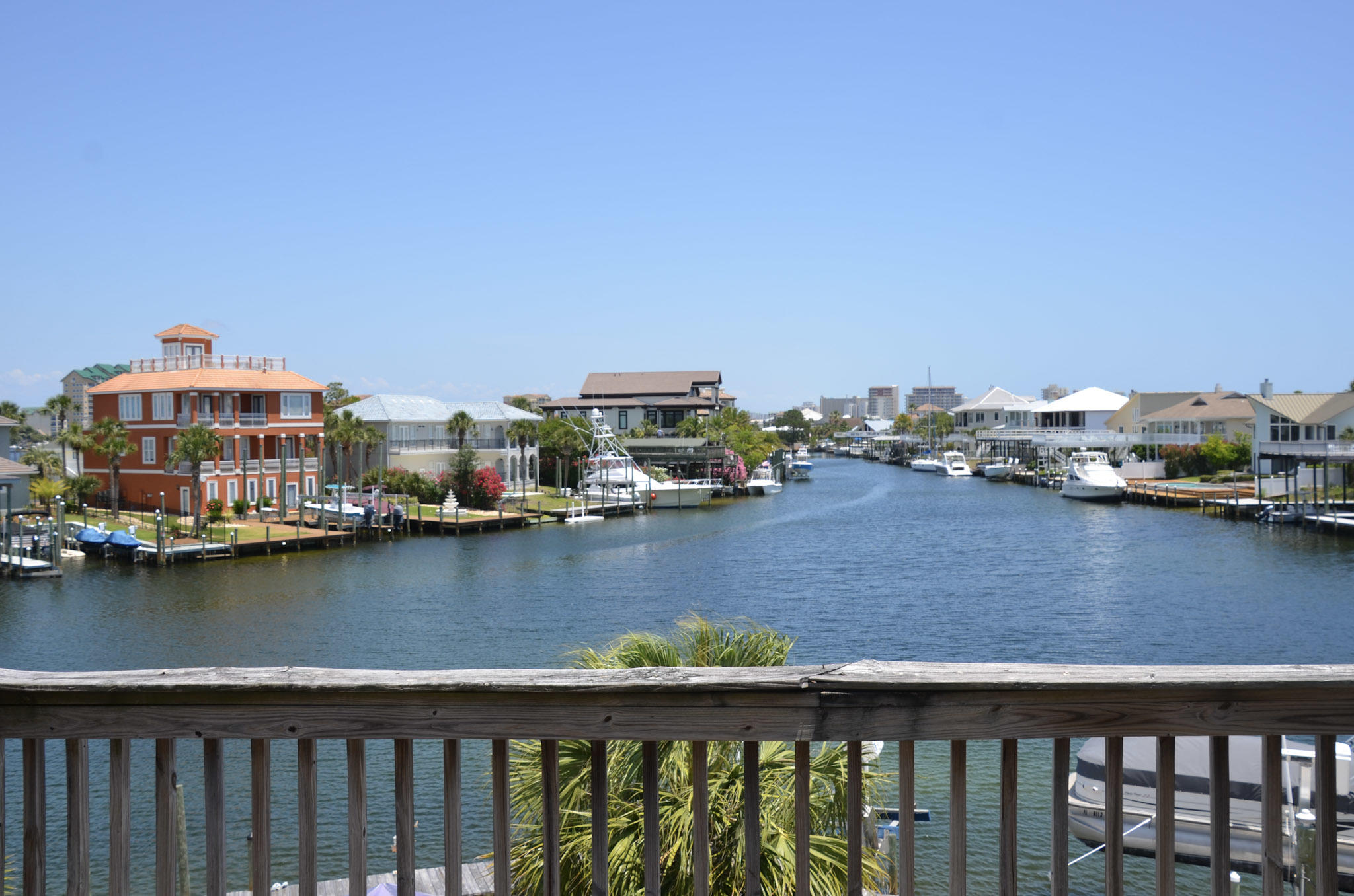 Ready to live the Destin life  all you need to bring is your toothbrush and your swimsuit. Welcome to 165 Durango, a beautiful, well-maintained, fully furnished waterfront town home located on a canal just off the Destin Harbor. Dock your boat at your backdoor. The boat lift is only 5 years old and can hold a boat up to 28 ft or 7,000 lbs. The owners say one of their favorite things to do is to watch the parade of boats come in after a fun day on the water. The water view is to the east which gives you ample sun in the cooler part of the day and shade in the afternoons when you really need it. Each floor has either a balcony or deck space so you can catch the view from multiple levels. Improvements include a new roof in 2019 and new HVAC in 2018. CLICK ''MORE'' FOR ADDITIONAL IN The living area and kitchen are situated on the second floor and boast custom concrete flooring. There is also a half bathroom on the second floor which is very convenient for your guests. Two of the bedrooms are located on the third floor, each with access to a full bathroom. The master bedroom features a private balcony with an amazing view of the water.  The master bathroom has tile flooring, a spacious vanity, and walk-in closet.  The bonus space behind the garage has been converted into an additional bedroom with its own private bathroom with laundry hook-up.  There is also private access to the back deck from this room.  This townhome complex has no Homeowners Association (HOA) so there are no monthly fees.  The owners say that they enjoy evening cocktails with their neighbors who are all very nice.  An additional bonus is the extra parking across the street for when you need it.  Whether you are using this as a primary, secondary or investment property, this one is sure to please!  PLEASE NOTE:  Artwork will not convey.