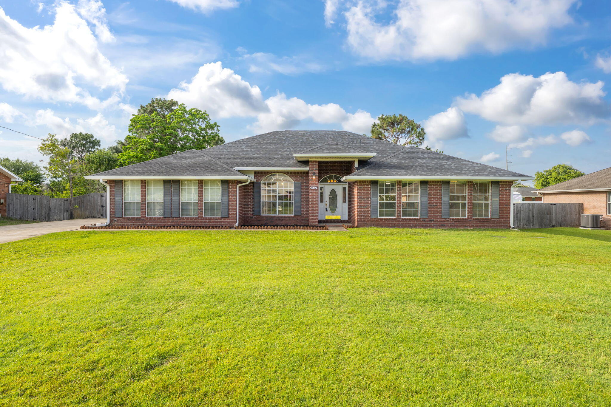 This ALL BRICK  home has almost 3000 SQUARE FEET! Featuring a SIDE ENTRY GARAGE, PRIVACY FENCED BACKYARD, and INGROUND POOL W/HOT TUB! The interior features SPLIT BEDROOM Floor Plan, OPEN CONCEPT GREAT ROOM W/FIREPLACE, FORMAL DINING ROOM with FRENCH DOORS and BUILT INS, SPACIOUS KITCHEN with TILE FLOORS, GRANITE TOPS with BULLNOSE EDGING, STAINLESS APPLIANCES, BREAKFAST BAR, ISLAND and BREAKFAST NOOK. The Master Bedroom has TREY CEILINGS with  the Master Bath featuring TILED FLOORS, JETTED WHIRLPOOL TUB, SEPARATE SHOWER, DOUBLE VANITY with GRANITE TOPS and HIS & HER CLOSETS. NEW ROOF & GUTTERS TOO! This home has tons of potential and with a little landscaping it could be your private tropical oasis! Schedule a showing today!