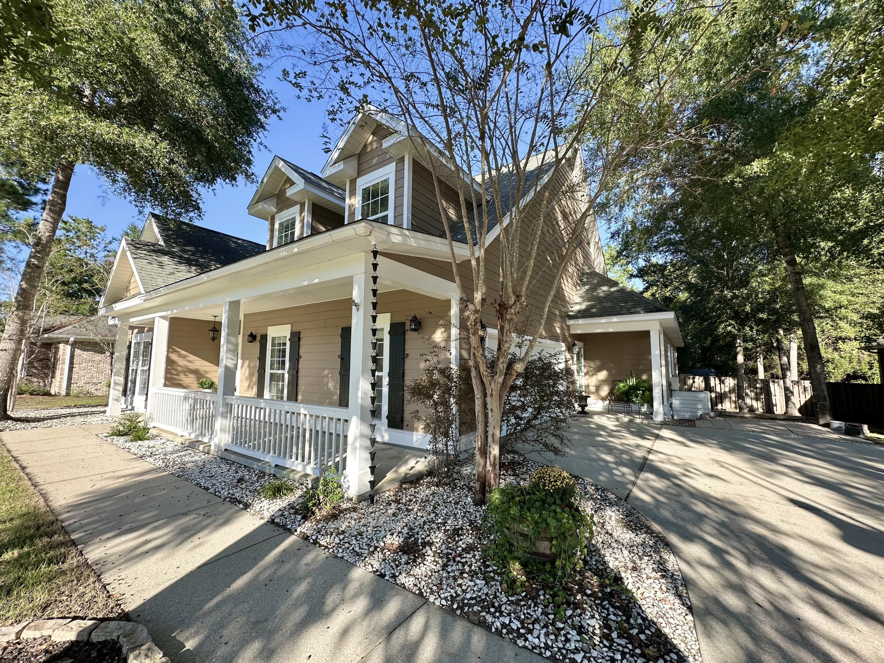 Welcome to this charming custom-built home in the highly sought-after Hammock Bay community of Freeport, where resort-style amenities and a true neighborhood lifestyle await. Step inside to a formal foyer and formal dining room, leading to an open living area filled with natural light and hardwood floors. The spacious great room opens to a covered patio and an expansive custom deck overlooking a serene preserve offering the perfect backdrop for relaxing or entertaining. The primary suite and two guest bedrooms are conveniently located on the first floor, while the second level features two guest bedrooms, a full bath, and a versatile bonus room ideal for an office, media space, or extra storage. Enjoy thoughtful upgrades throughout and quality finishes that make this home truly stand out. New wall oven and microwave 2025, freshly replaced/sealed deck, and recently painted inside and exterior painted within the last 3 years make this home is move-in ready.

Nestled within Hammock Bay, residents enjoy miles of walking trails, clubhouse, fitness center, sports courts, pools, a dog park, playgrounds, community events, and access to the Bay. Start your mornings with coffee on the spacious front porch and soak in the charm of this beautiful community. Homeowner is a licensed FL Real Estate Agent.