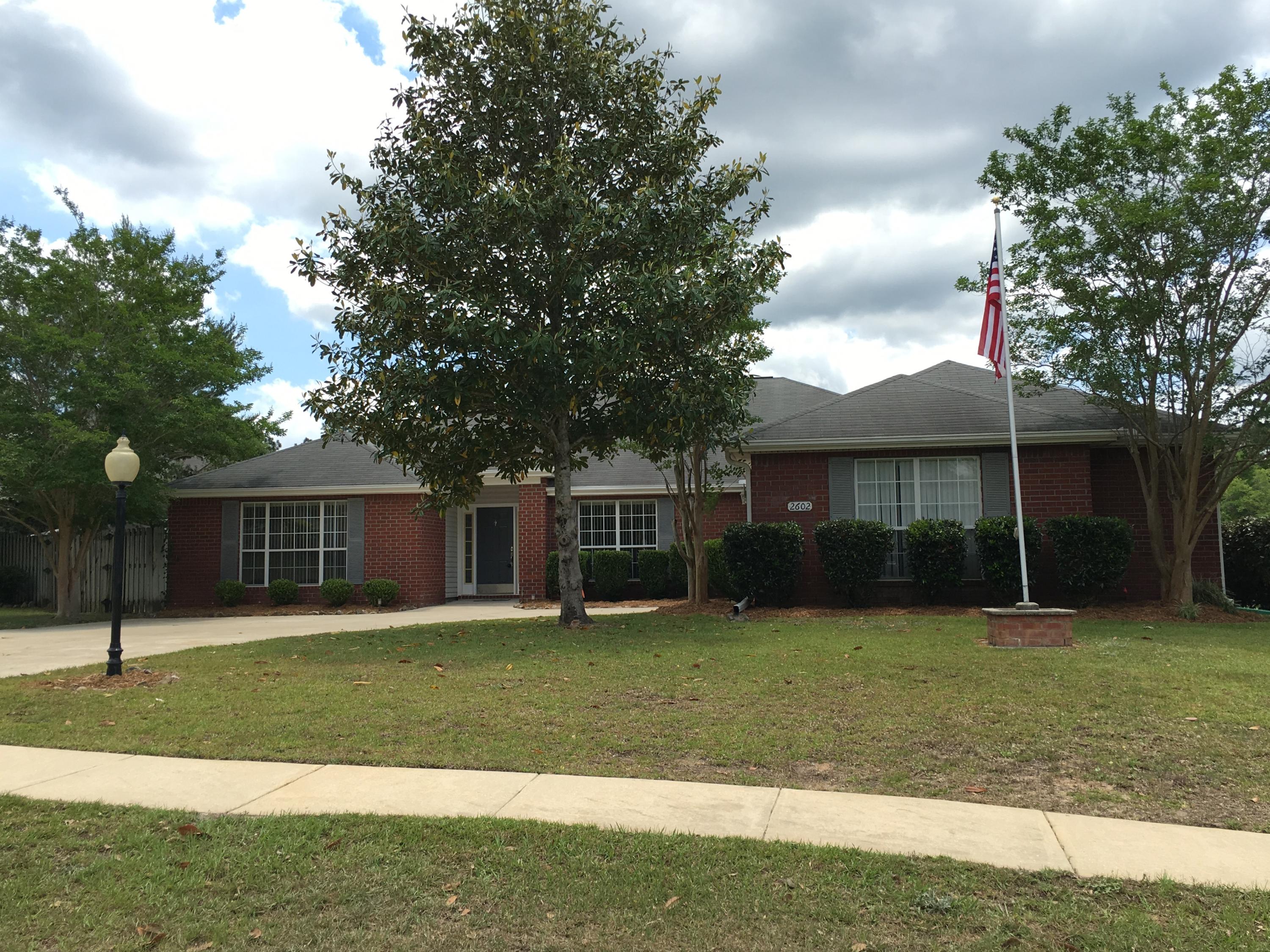 Available now! With in-ground pool! This is a 4/2 beautiful brick home in Silver Oaks Subdivision on a corner lot. Large family room with fireplace, vaulted ceilings, & plant shelves. In addition to the 4 bedrooms, there is a formal dining room and formal living room with French doors that could serve as an office. The kitchen is abundant with cabinets galore, pantry, breakfast bar, and center island. Bathrooms are also tiled and have marble sinks & showers. The master bath is spacious w/walk in closet. The 2nd bedroom has walk in closet. This split floor plan is beautifully laid out for mom & dad or the couple who has the frequent visitor. Very large laundry room and 2 car garage. A small dog will be allowed with pet fee and breed approval. Subdivision has a community pool.