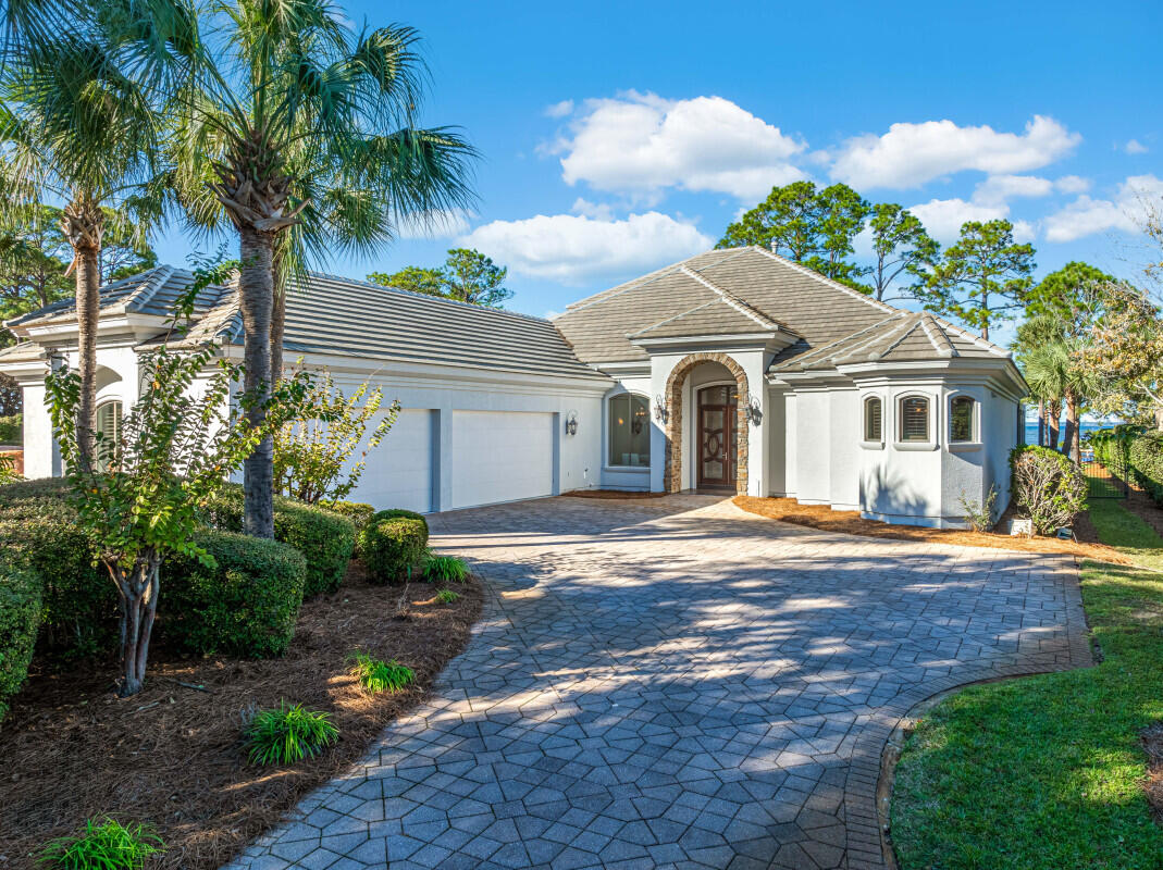 This amazing Bay Front custom-built, Estate home is the best priced bay home currently on the market! 4200 interior Square feet.  97 linear feet of Bay frontage, on a lot that measures approximately 97 x 330. 
Private, screened L-shaped pool, measuring 38 feet long, 10 feet wide, with an additional 25 ft width for the built-in Spa. 
Conveniently located in Miramar Beach, close to shopping and dining, yet nestled away in a quiet, friendly neighborhood.
Inside, you'll relax with a custom home, 12 foot ceilings on the first level, including 2 living areas, gourmet kitchen with Wolff and Subzero appliances. Formal Kitchen, separate eat-in area. The master suite features a large bayfront bedroom, with large, walk-in closet with built-in cabinetry, and a large custom bath, with separate spa tub, custom shower with 2 wall shower heads, one rainhead, and 2 body sprays. 3 additional bedrooms on the first level and 2 additional full baths. Large Laundry room on the first level as well.
The second level features a large great room, with amazing bay views and balcony. Also on this level is another large bedroom, with private bath.
Need storage space for your cars and belongings, check that box off as well, with the oversized attached 4-car garage.
For the Boater, the Dock is in place and ready for your boat!
Exterior features include Stucco Exterior, and recently installed concrete tile roof. Large paver driveway. Over 7/10s of an acre beautifully landscaped and manicured lot!
Extra bonus, additional spray foam insulation to help lower utility bills!
Easy to show, call today to view the bay front home that you've been waiting for!